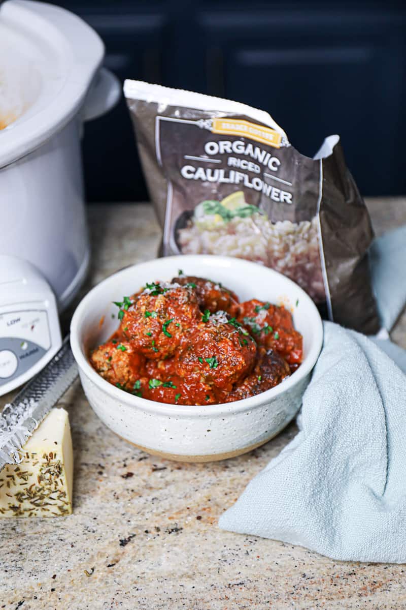 Slow Cooked Meatballs With Trader Joe's Cauliflower Rice bag.