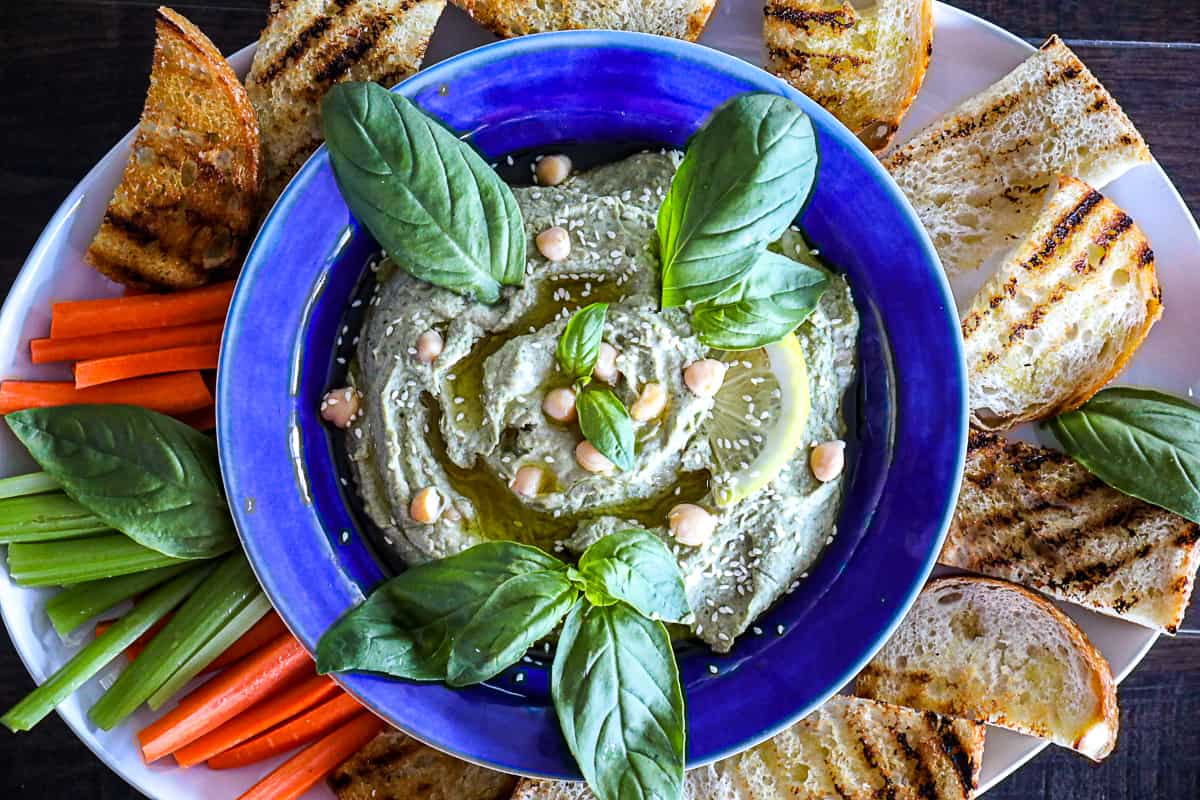 Basil Hummus Appetizer Platter With Toast and Vegetables