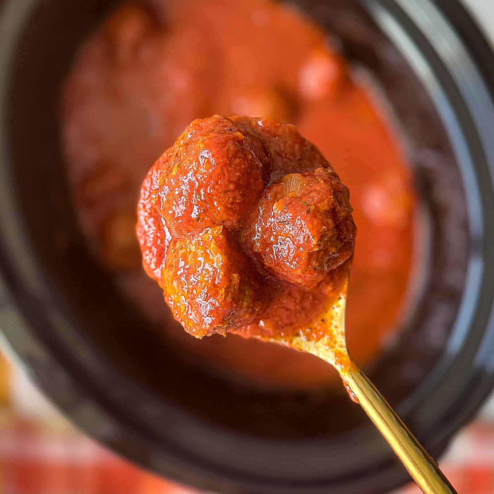 Slow Cooker Meatballs in Tomato Sauce Slow cooker filled with tender meatballs simmering in rich tomato sauce