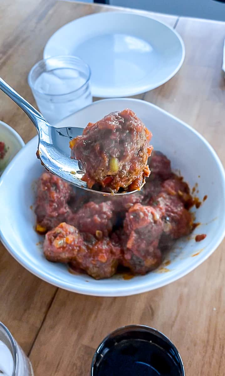 Slow cooked Meatball Sliders for a crowd in a serving bowl.