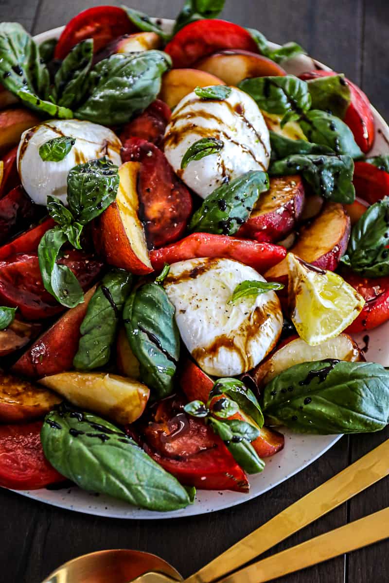 Cold summer salad with fruit peaches.