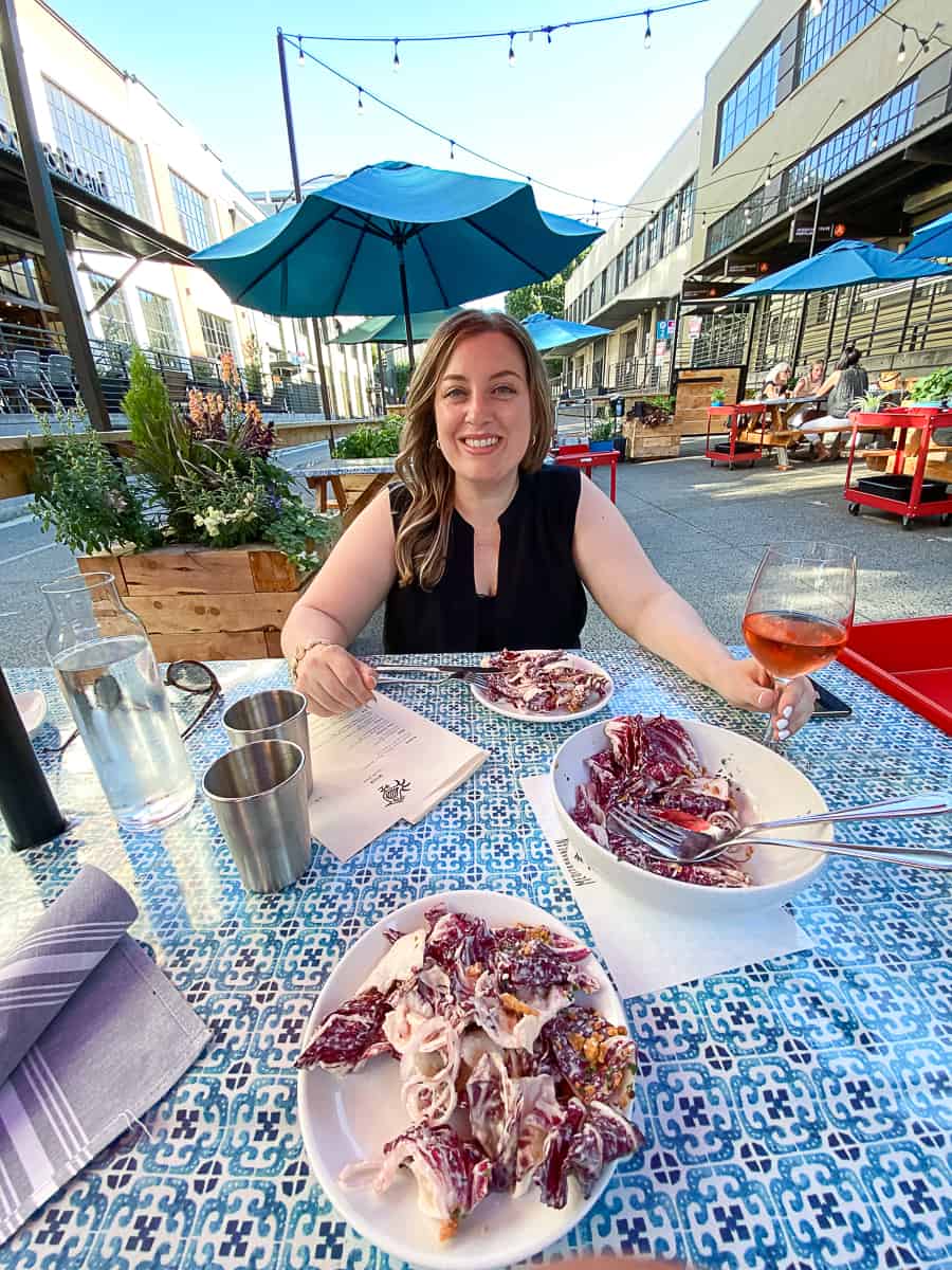 Woman dining eating Radicchio Salad at Mediterranean Exploration Company