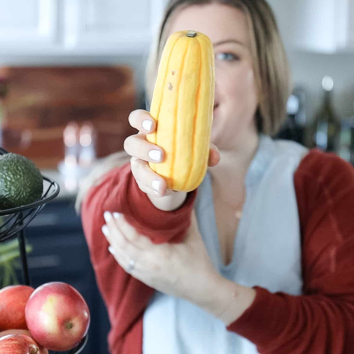 holding produce demonstrating the Best Fall Fruits and Vegetables In Season