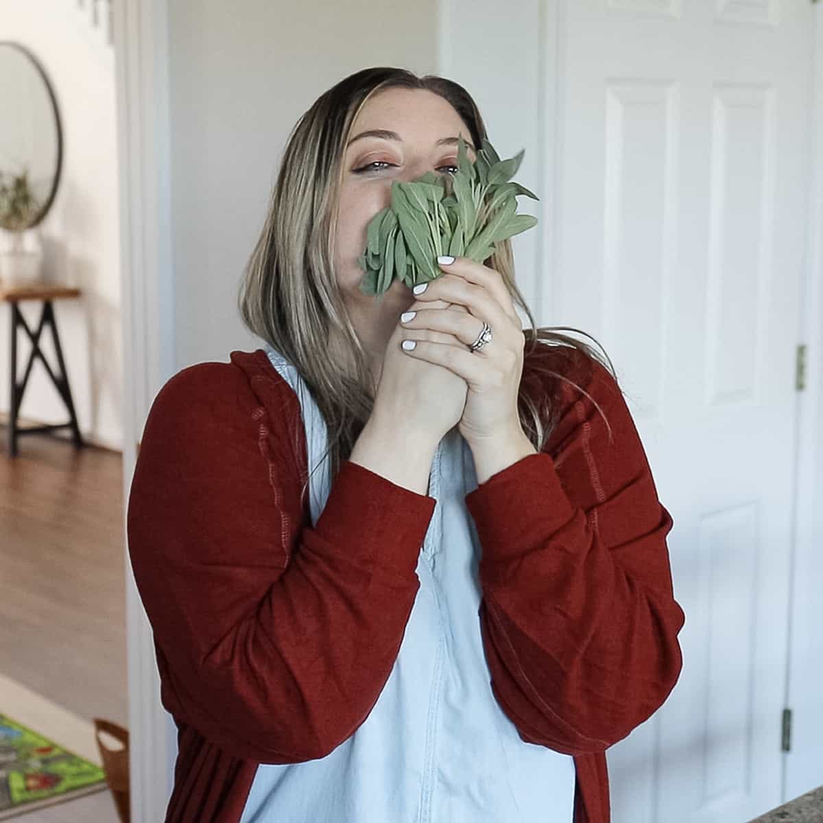 holding fall herbs sage