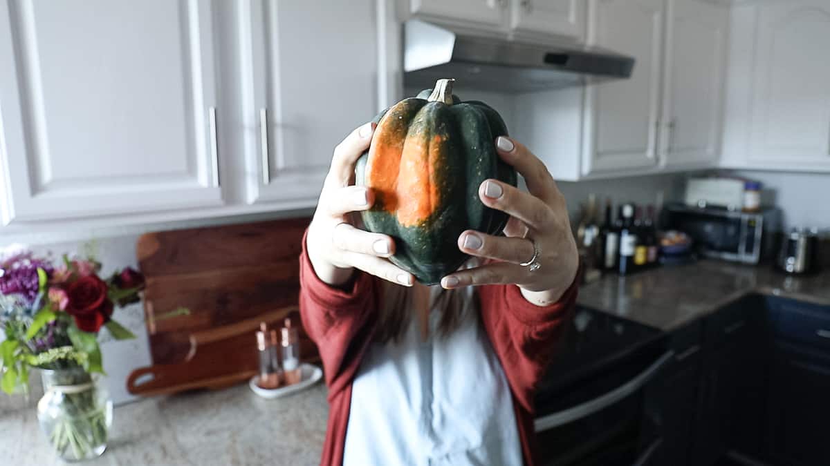 holding fall seasonal vegetables acorn squash