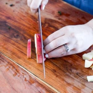 demonstrating how to dice apples