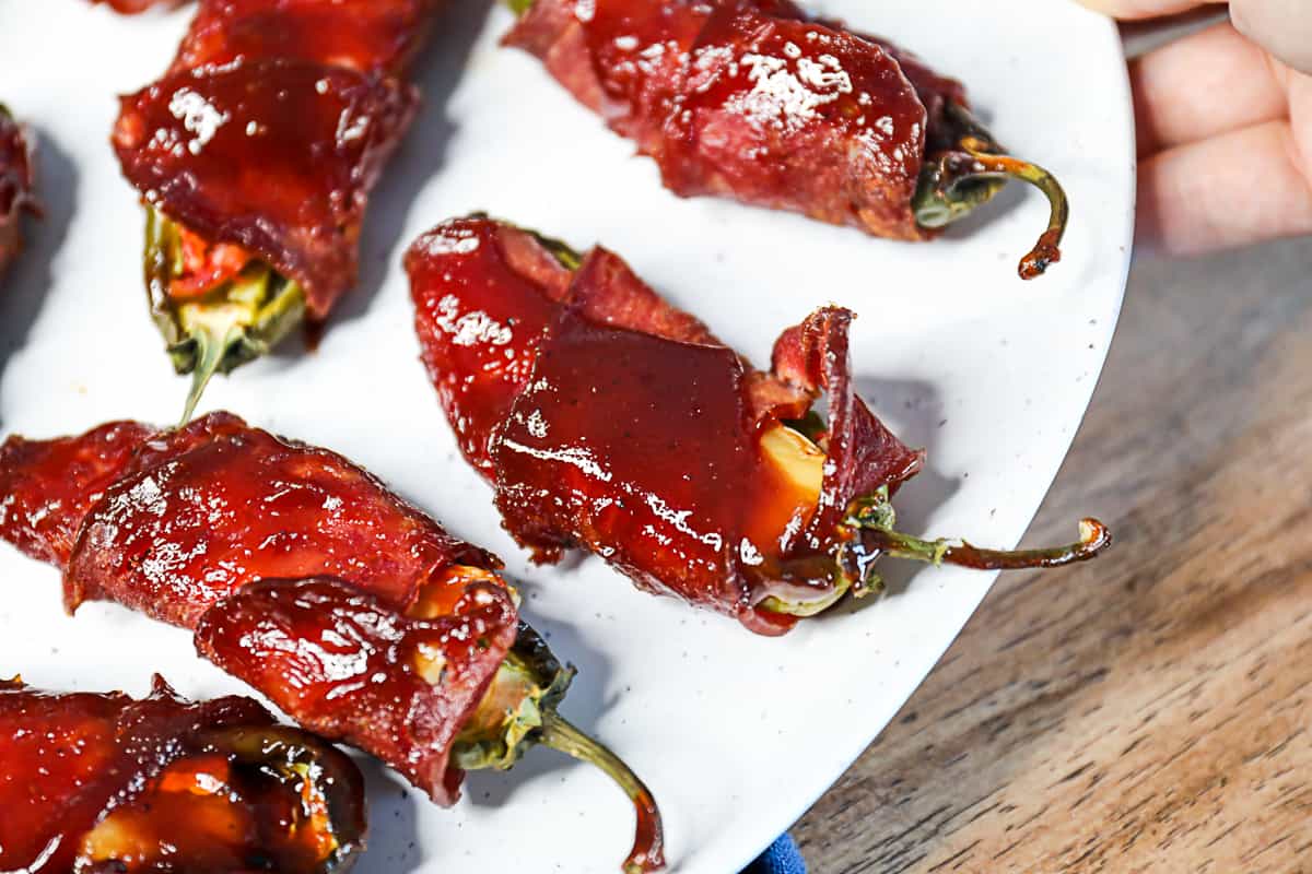 Traeger Smoked Jalapeno Poppers wrapped in Bacon and BBQ sauce