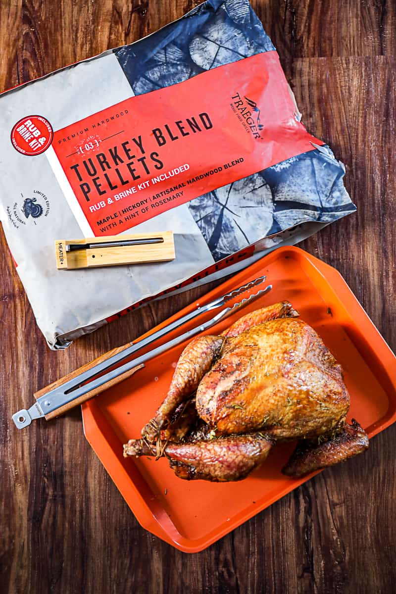 Traeger Turkey Pellets Kit with Brine Turkey Rub Seasonings And Smoked Turkey on a tray