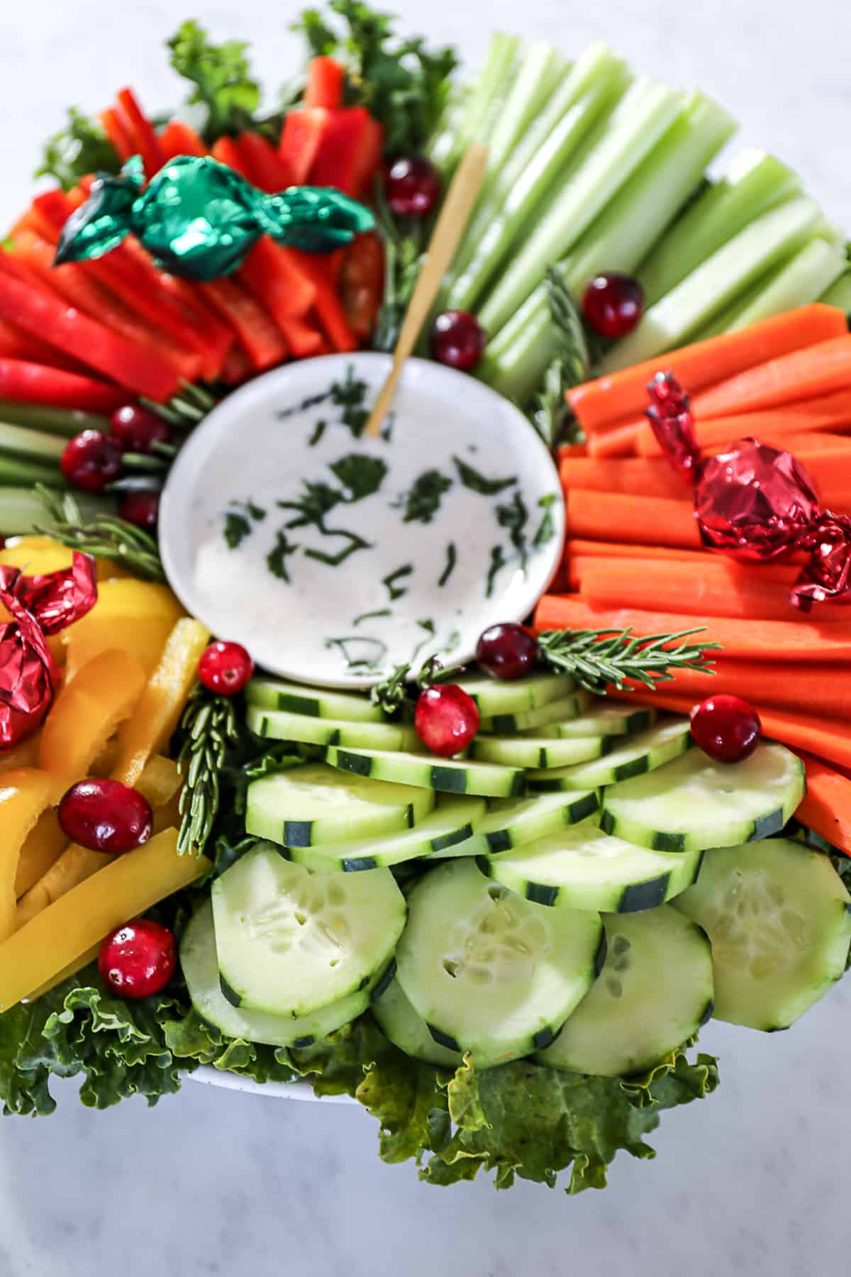 Holiday Party vegetable platter in the shape of a wreath with dip in the center and fresh raw vegetables
