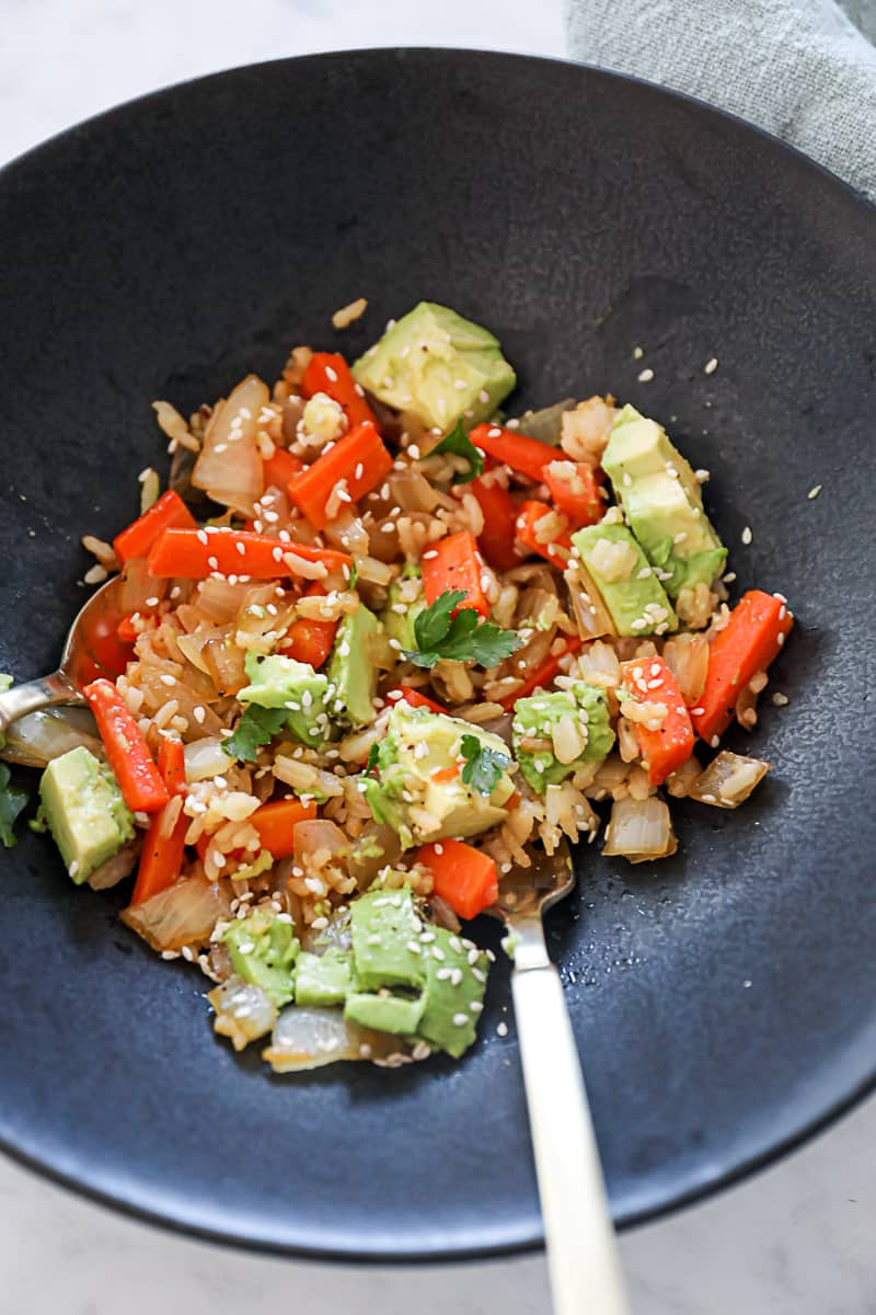 Recipe using leftover rice in a stir fry with carrots onions and avocado