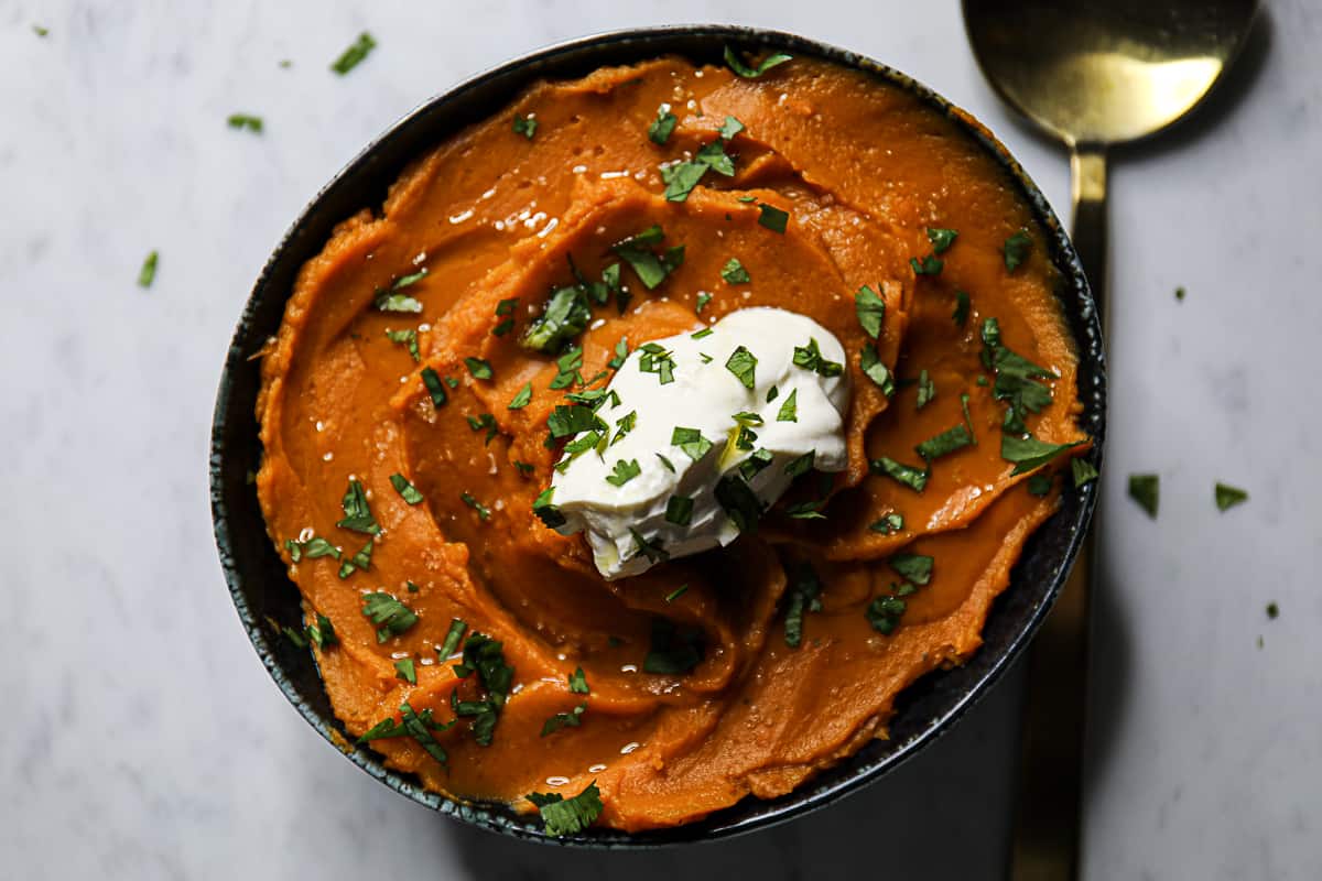 Bowl of crockpot cooked mashed sweet potatoes