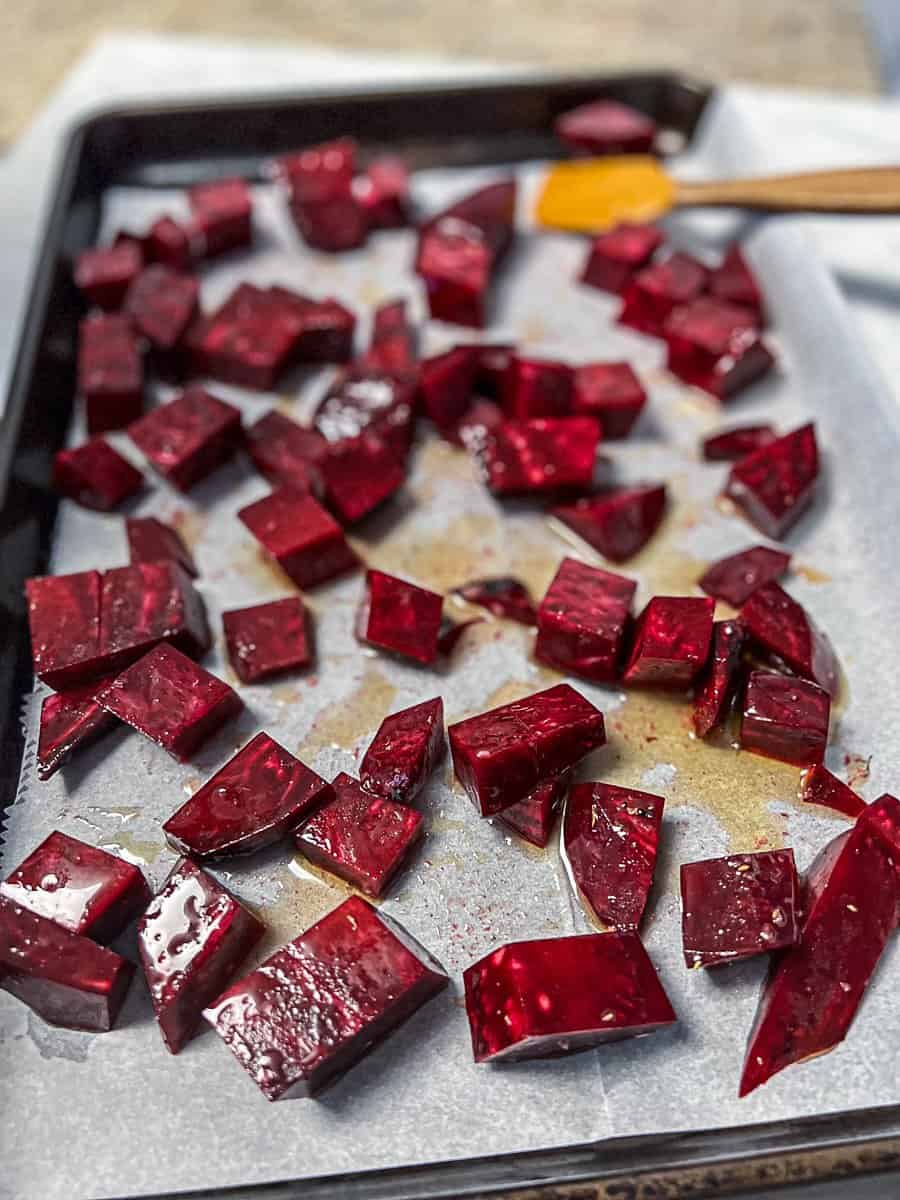 Demonstrating roasting beets in oven without foil on parchment paper