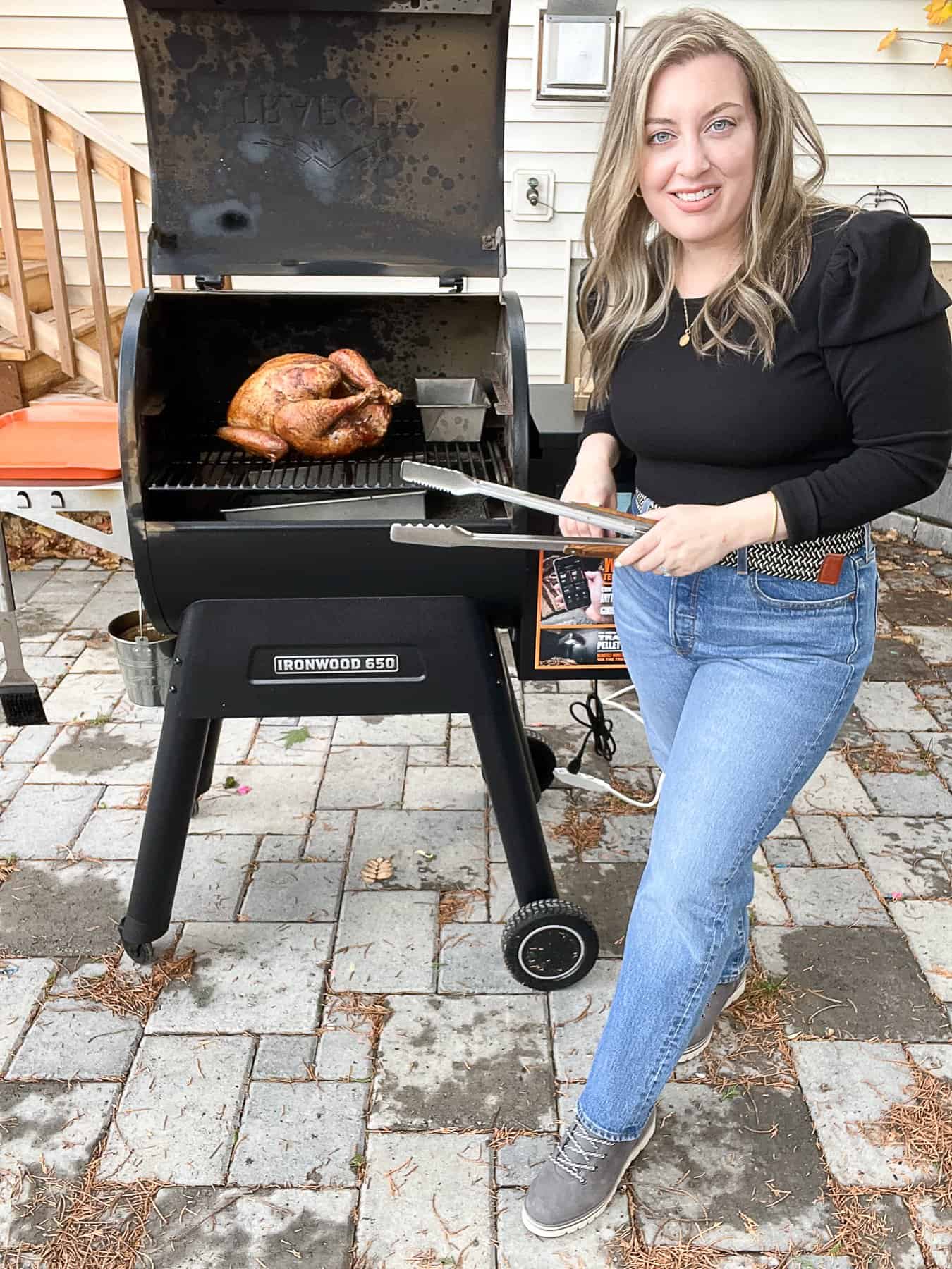 Jenna Passaro Sip Bite Go Food Blogger With Traeger Ironwood 650 Smoking Turkey for Thanksgiving