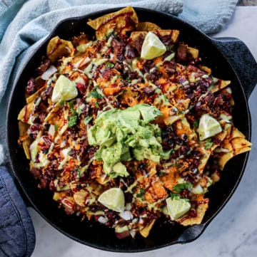 Traeger Smoked Nachos with bbq sauce and cheddar cheese
