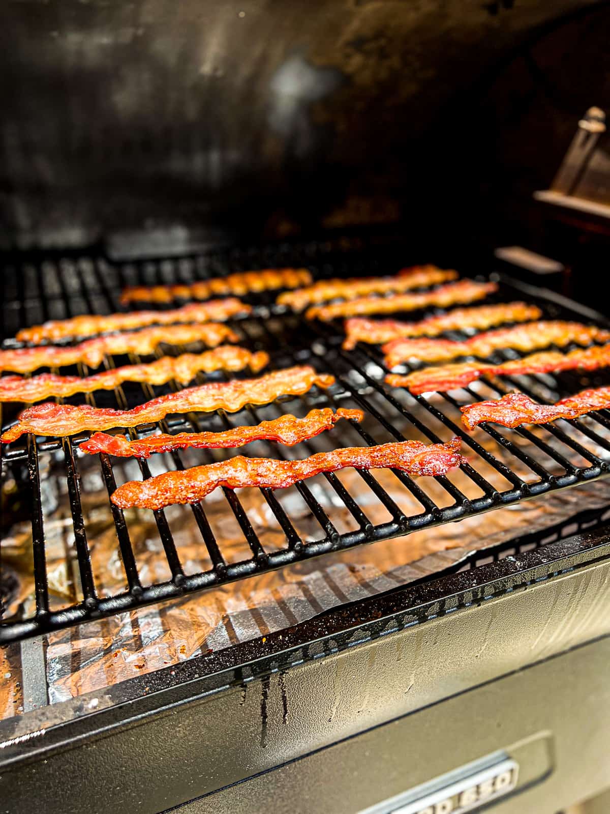 Closeup of Traeger pellet grill Smoker Bacon slices