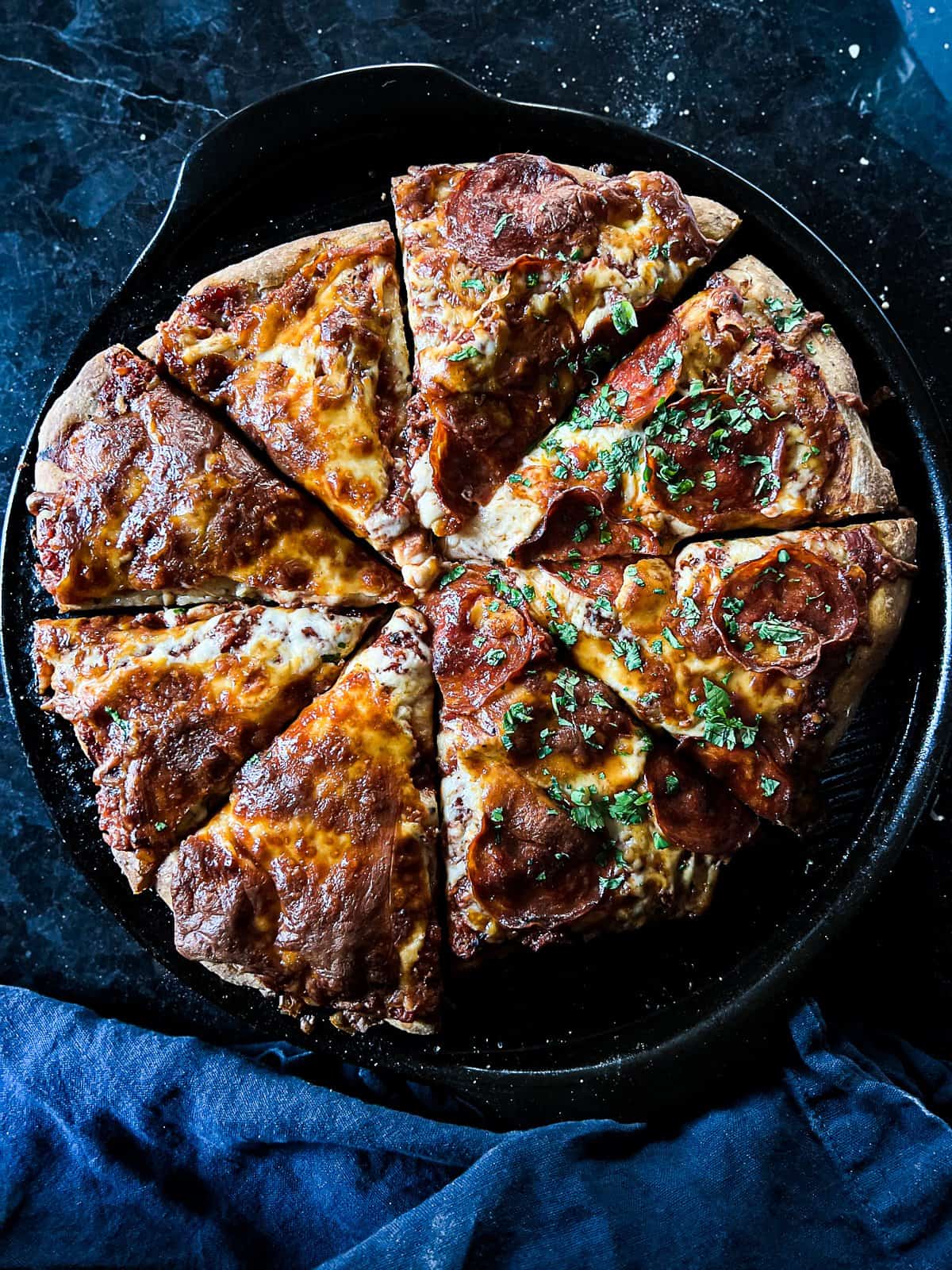 Homemade pizza on pizza stone with crispy crust