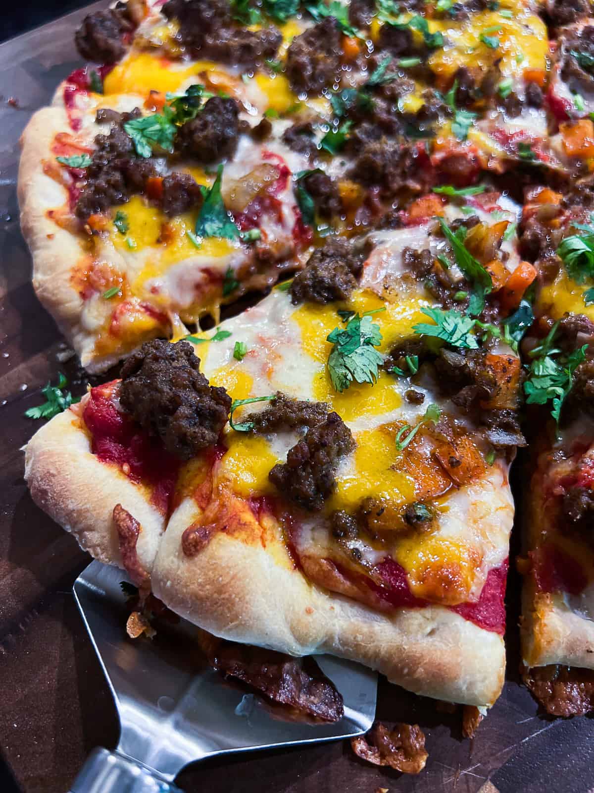 Ground beef and vegetables recipe on pizza as leftovers