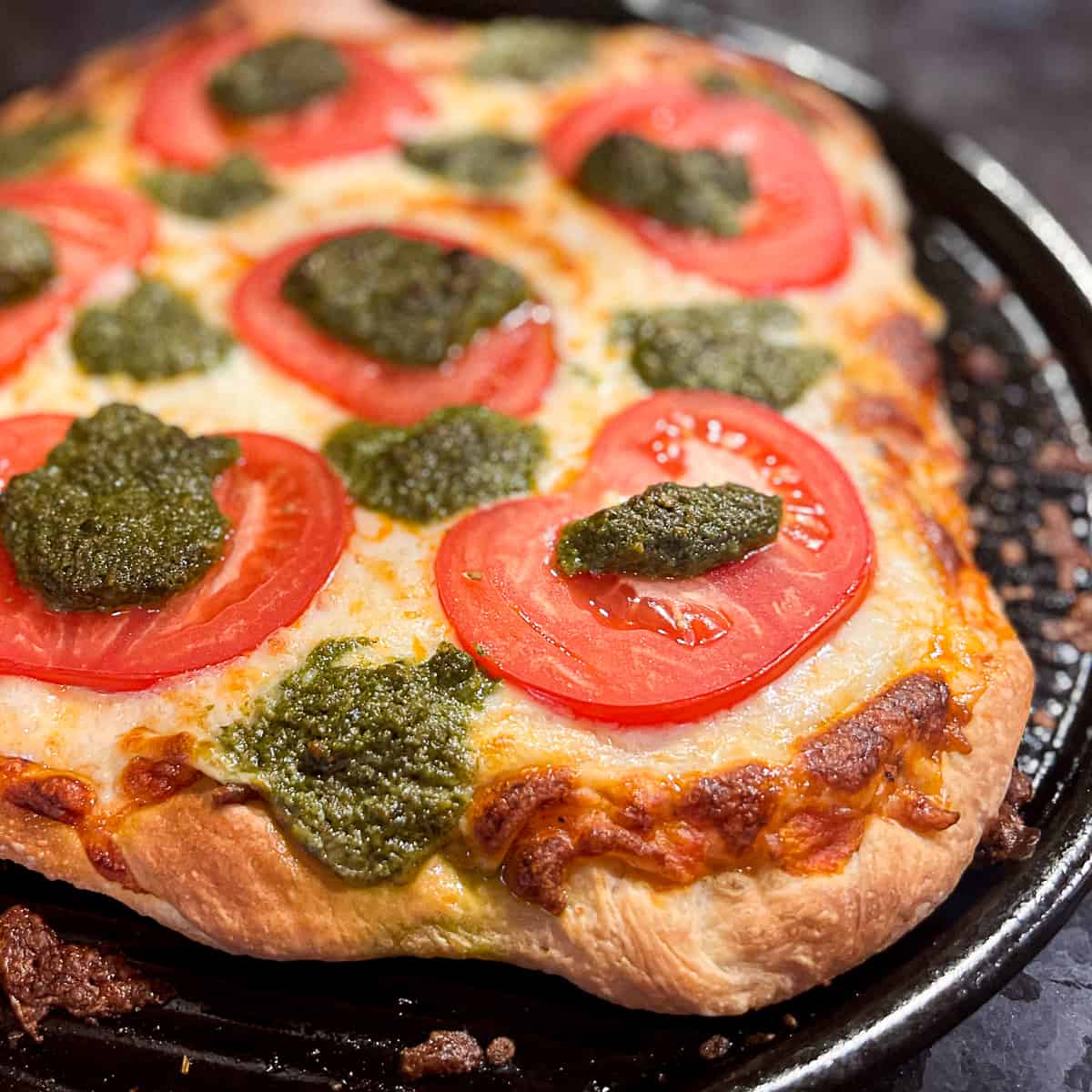 Pizza Stone Oven Baked Pesto Pizza With Tomatoes And Mozzarella Cheese