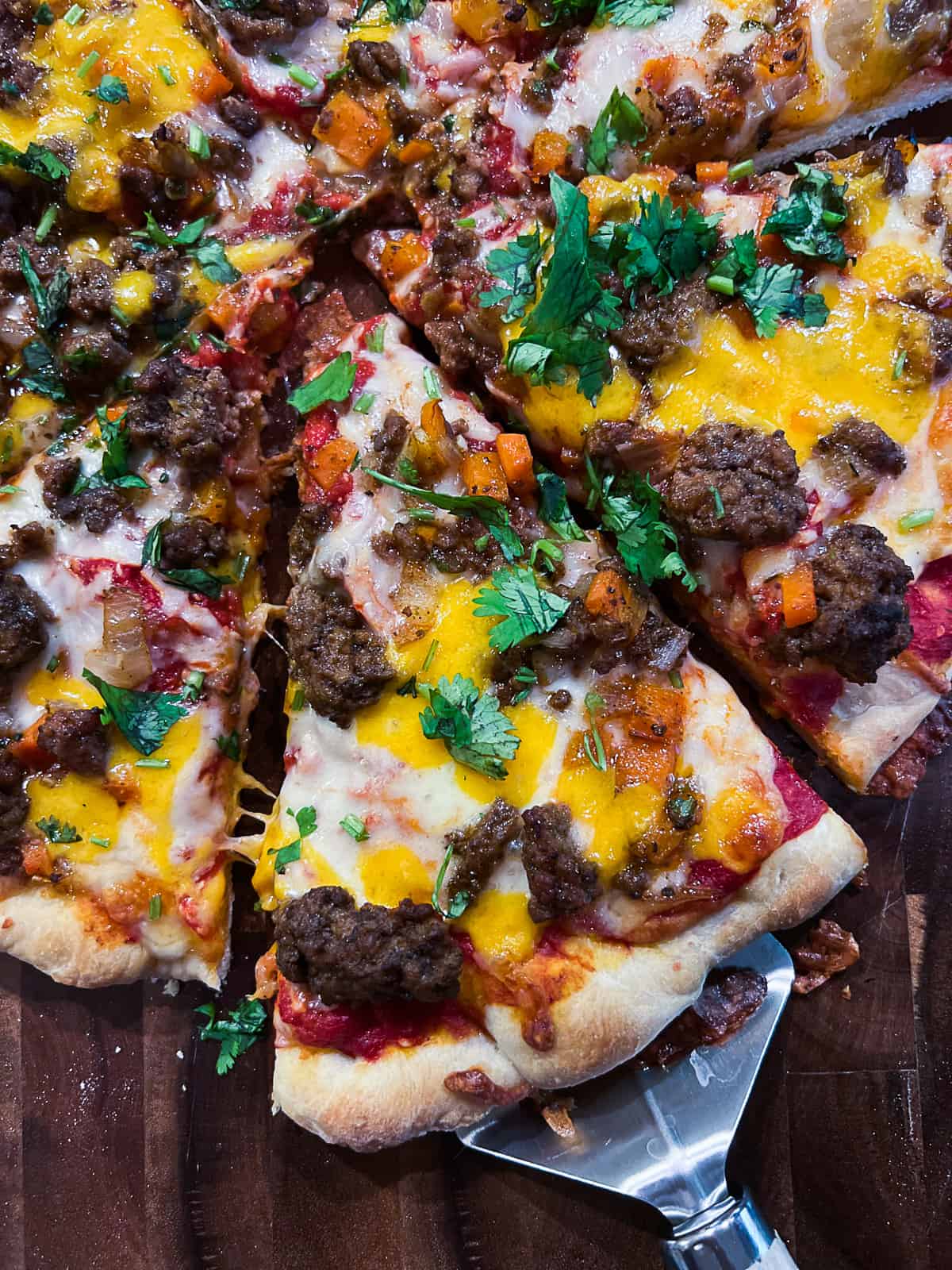 Slice of Mexican Pizza With Taco Seasonings and Ground Beef