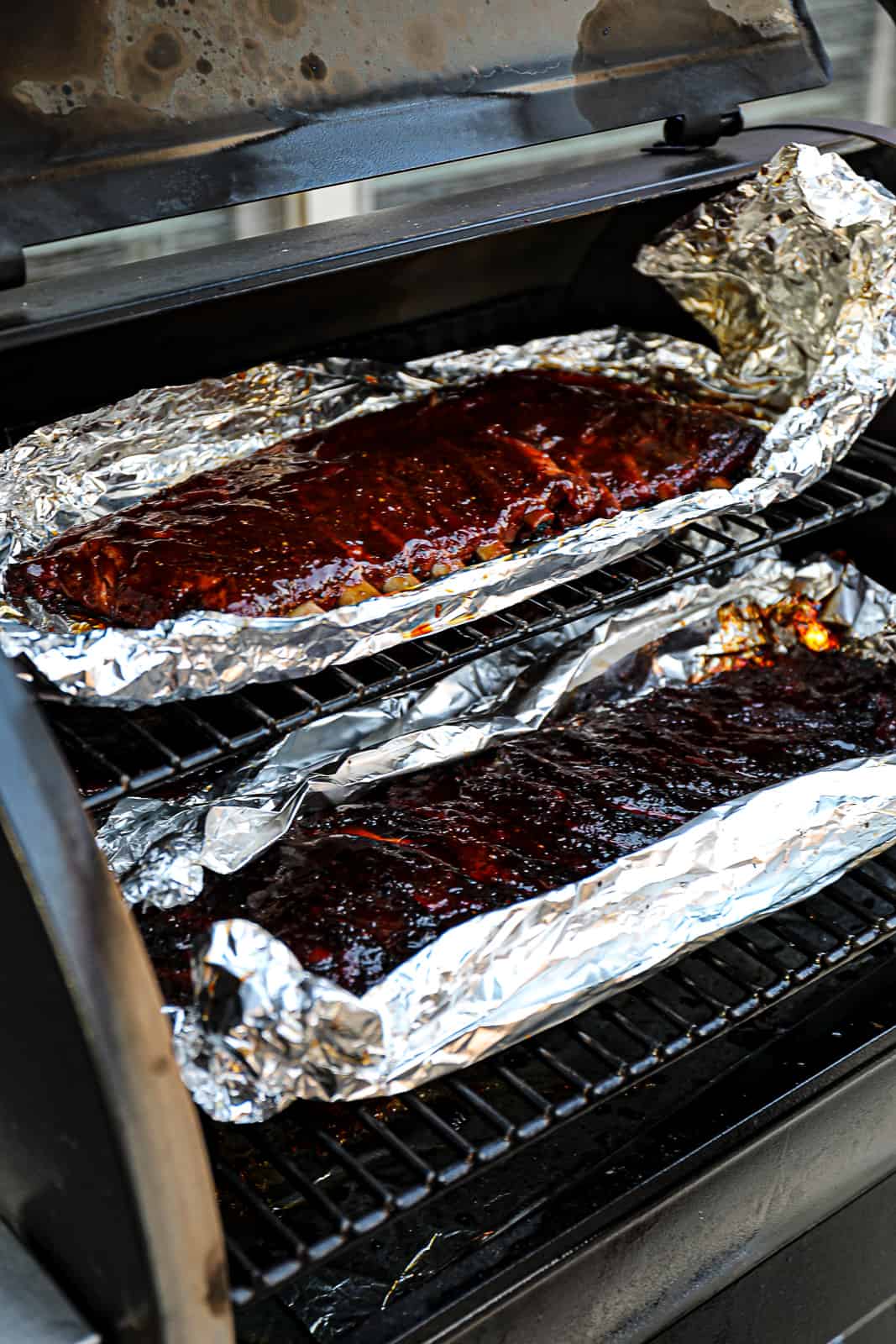 Foil Wrapped Smoked St Louis Ribs cooking in Traeger Grills