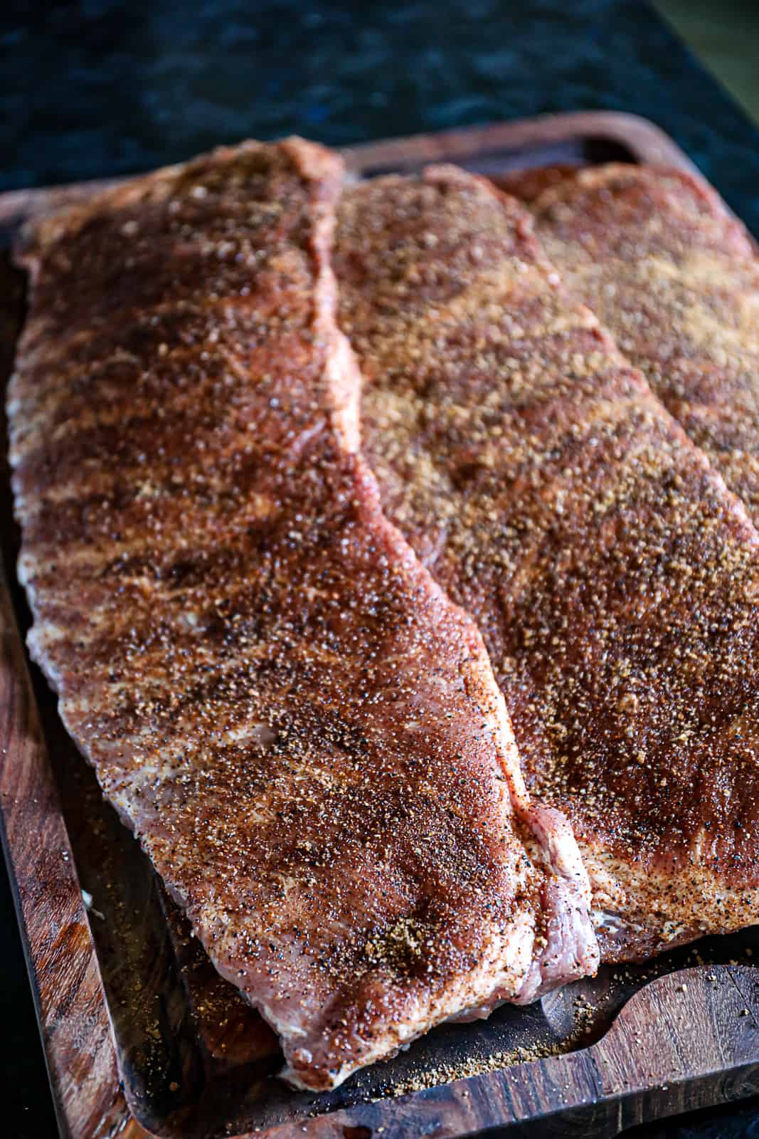 Seasoned racks of St Louis ribs for smoking