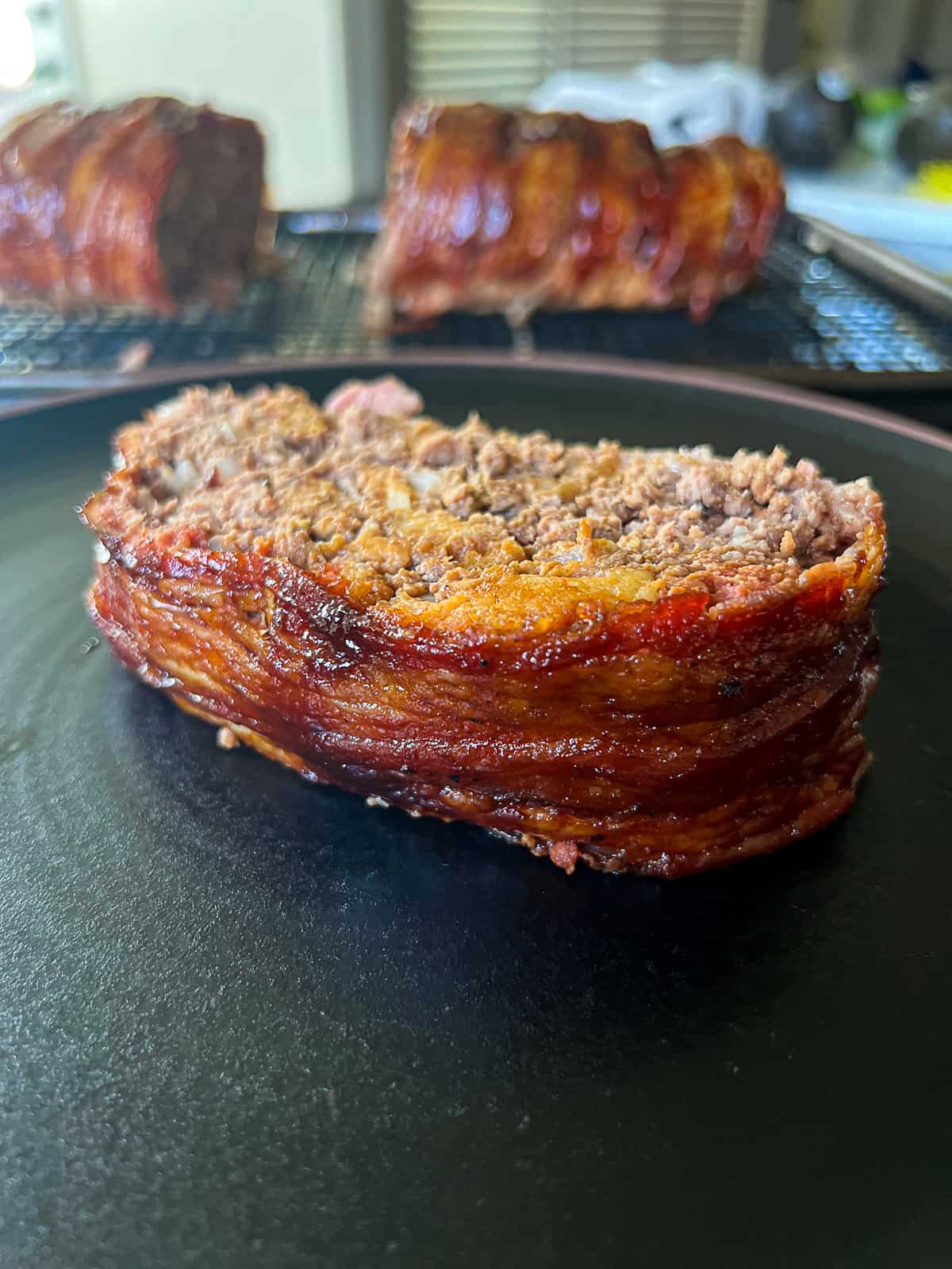 Slice of Traeger Smoked Bacon Wrapped Meatloaf