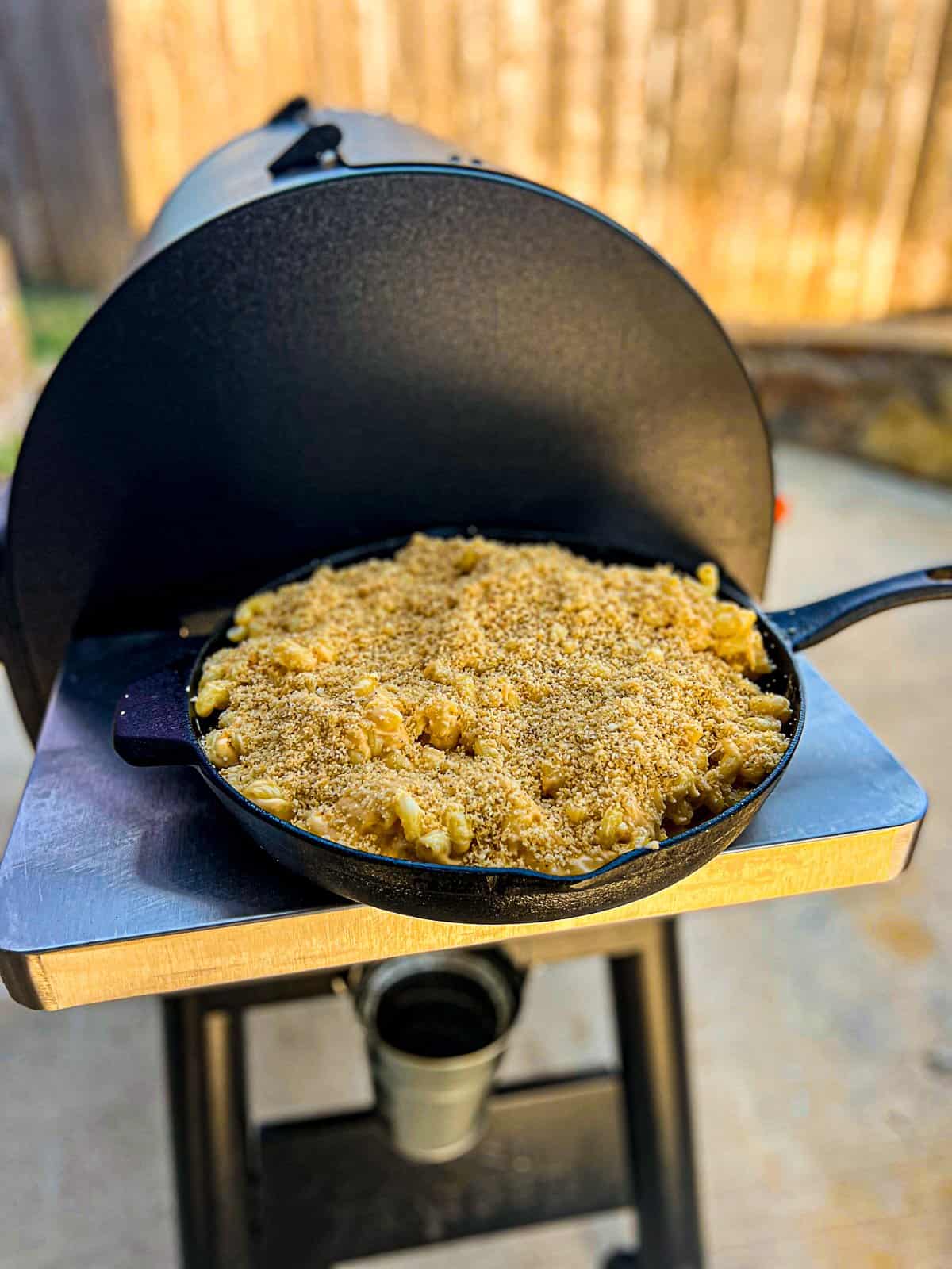 Traeger Grills with Smoked Mac And Cheese in a cast iron skillet to feed a crowd