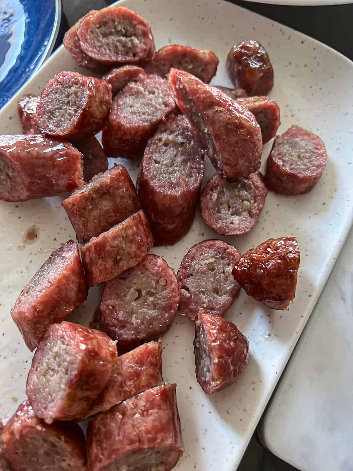 Diced Traeger Smoked Brats on an appetizer platter