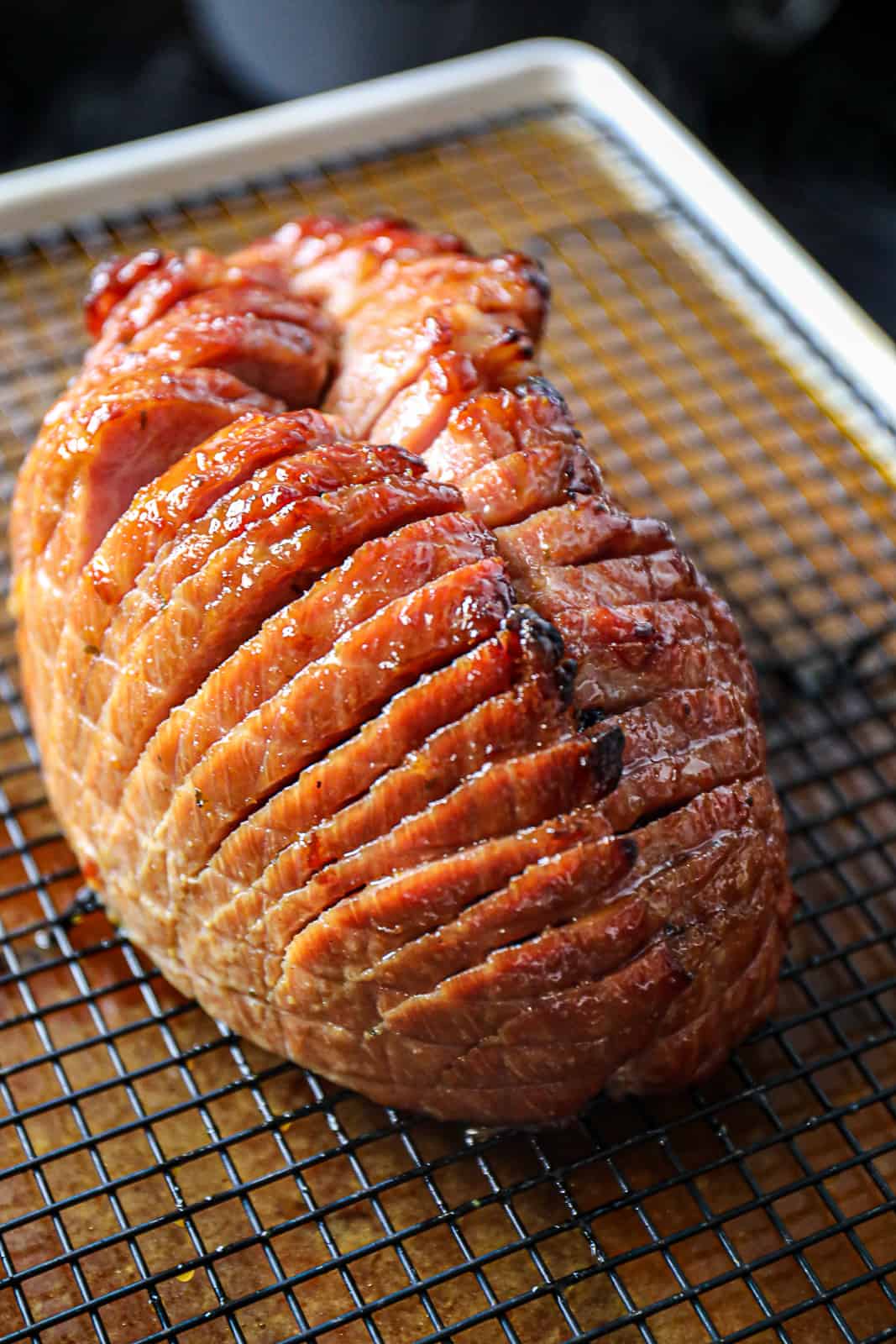 Honey glazed ham on baking sheet