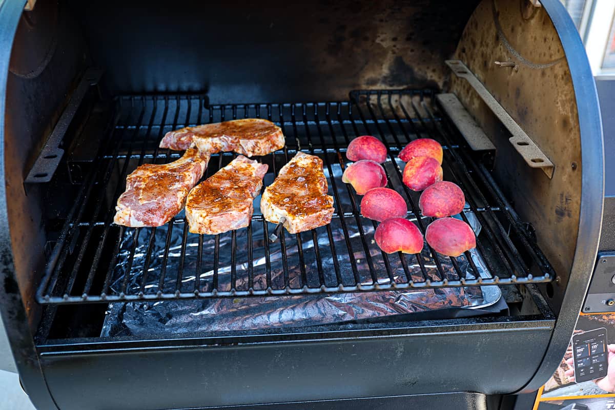 Smoking pork chops with smoked peaches on the Traeger