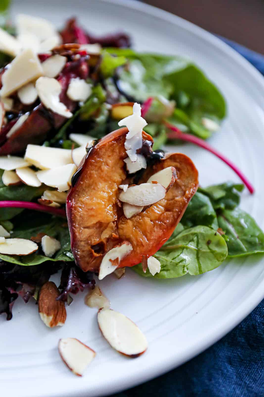 Traeger Smoked Peach Appetizer Salad with almonds and balsamic glaze
