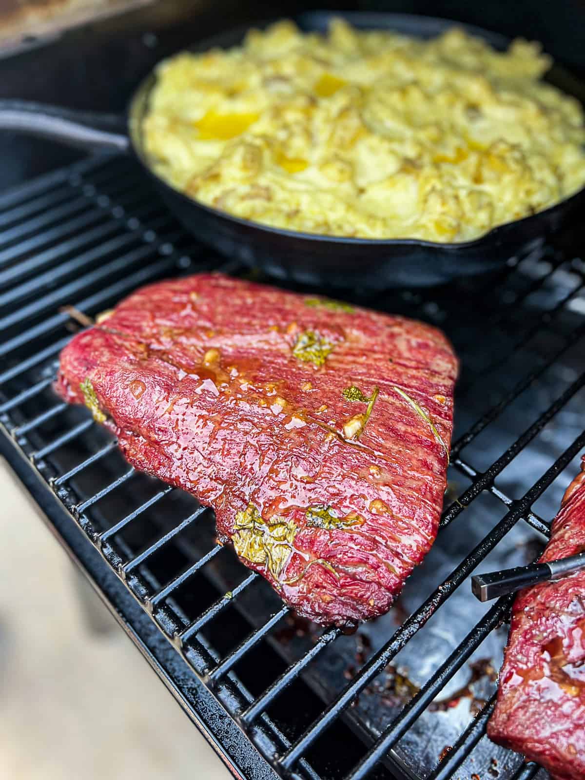 Traeger Smoking Flank Steak on the pellet grill with mashed potatoes
