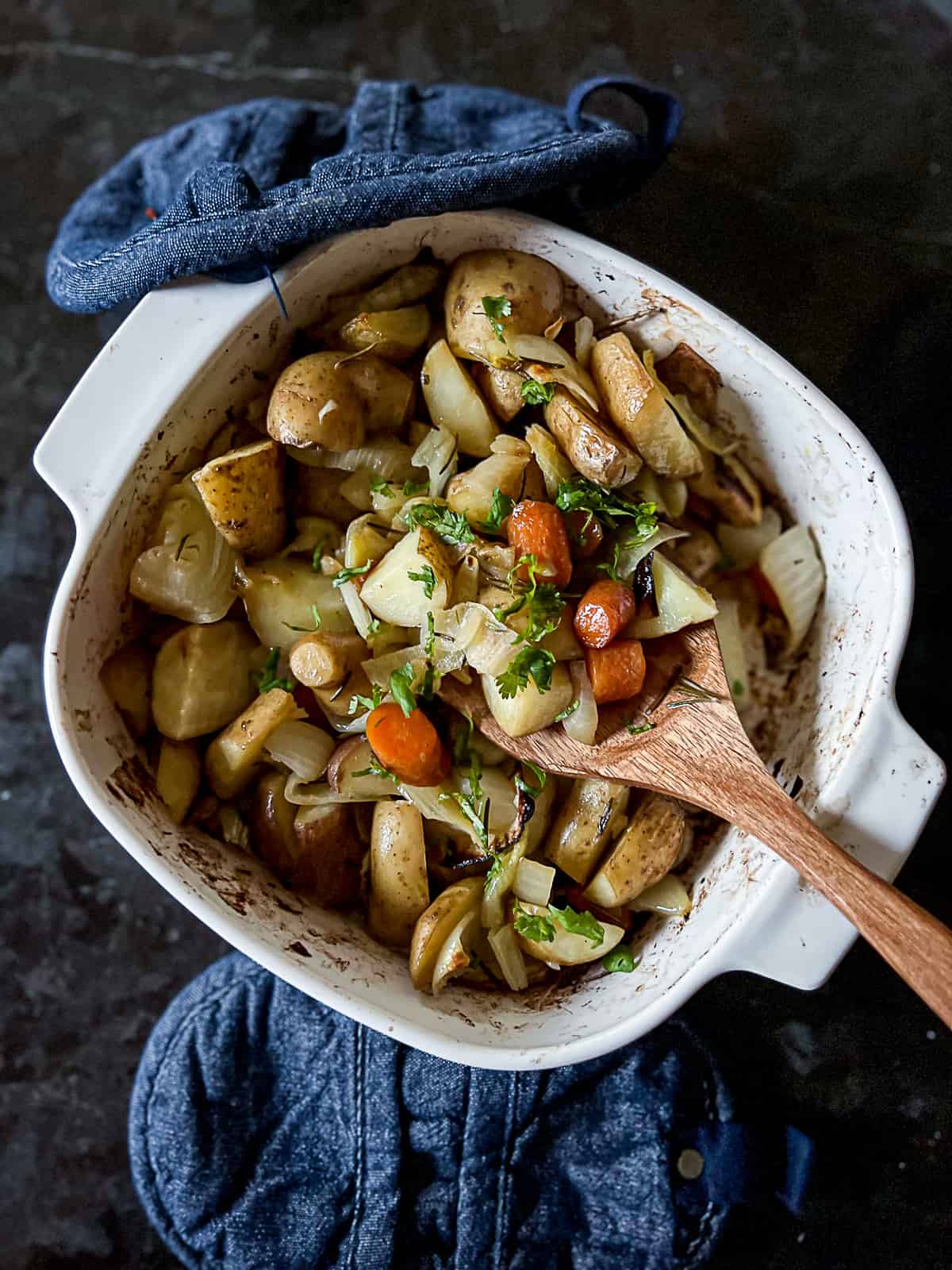 Casserole Dish With Roasted Potatoes Carrots and Onions