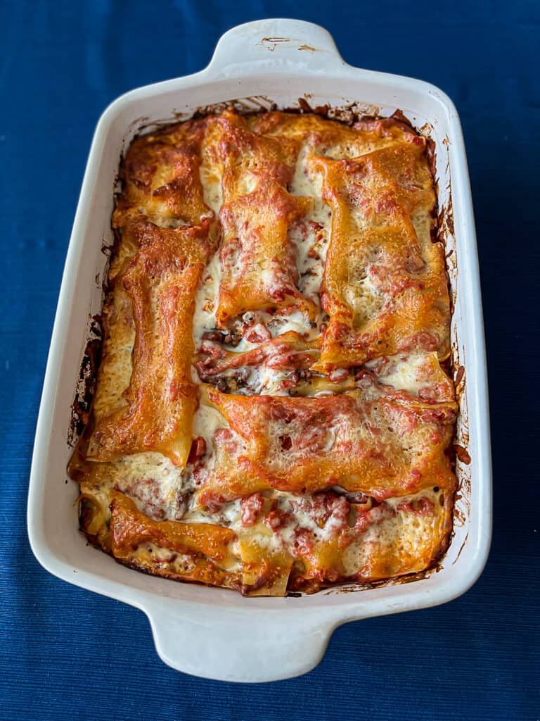 Cheesy Traeger Smoked Lasagna With Ground Beef - Sip Bite Go