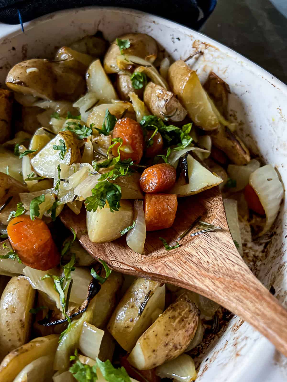 Closeup of Oven Roasted Potatoes Carrots Onions With Garlic and Herbs