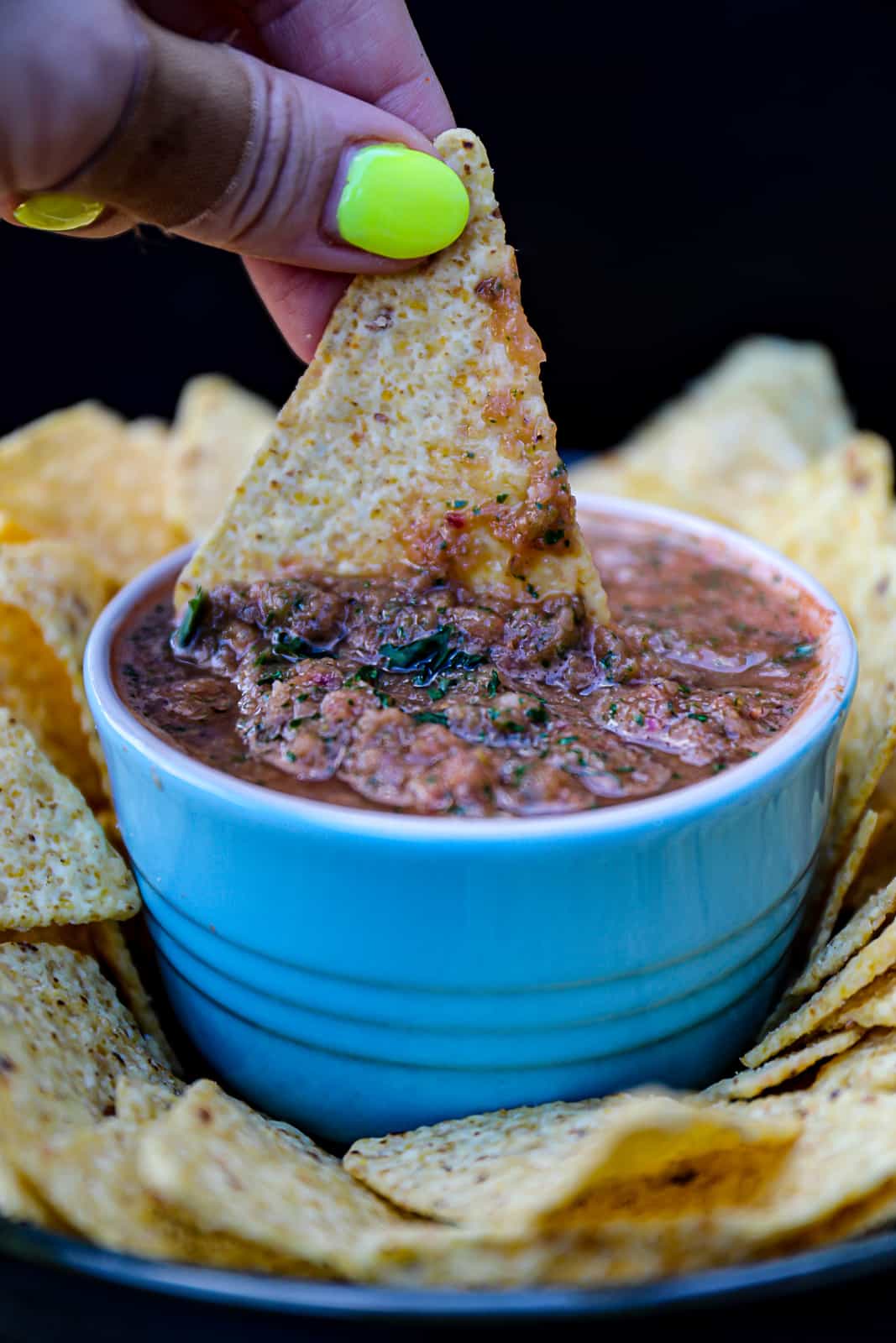 Dipping Tortilla Chips In Homemade Smoked Salsa Appetizer