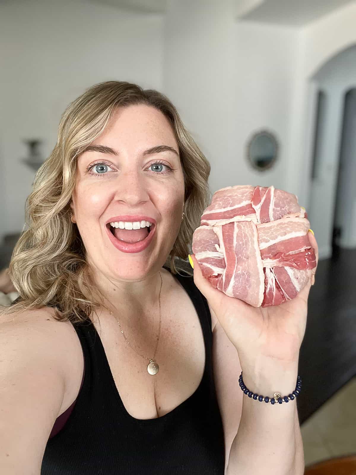 Food Blogger Jenna Passaro From Sip Bite Go Holding A Bacon Wrapped Burger Recipe