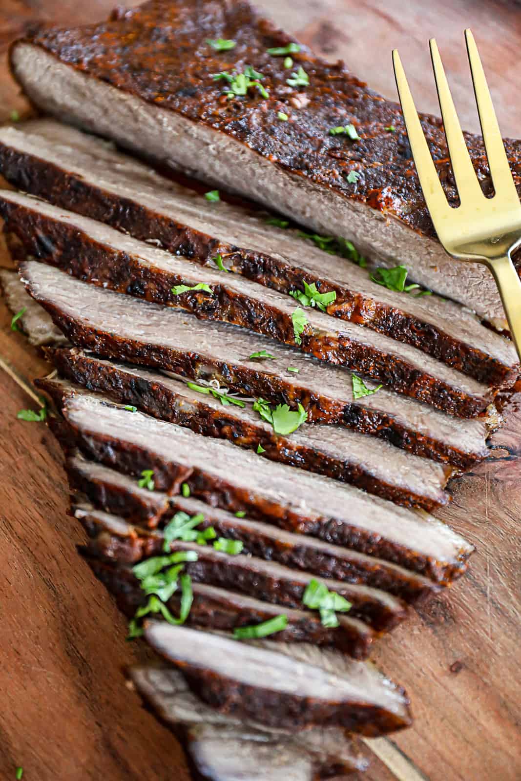 Oven Baked Beef Brisket Sliced On Cutting Board