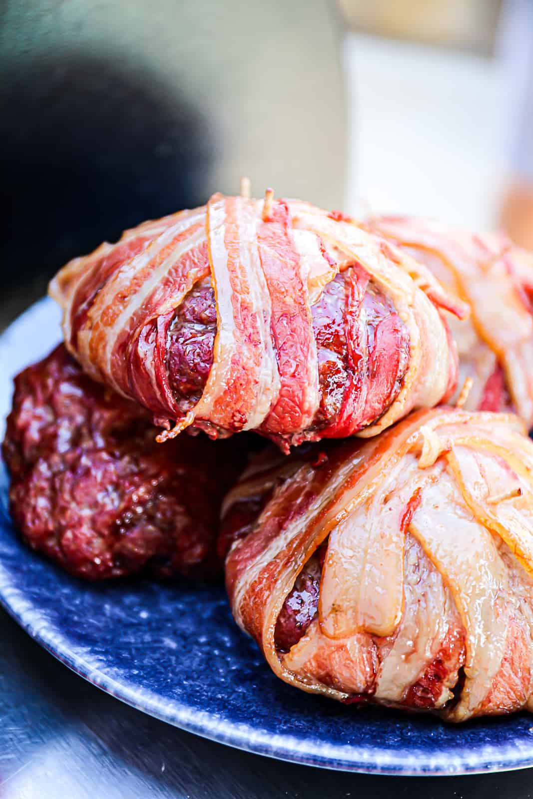Traeger Smoked Bacon Wrapped Burgers Resting On A BBQ Party Tra