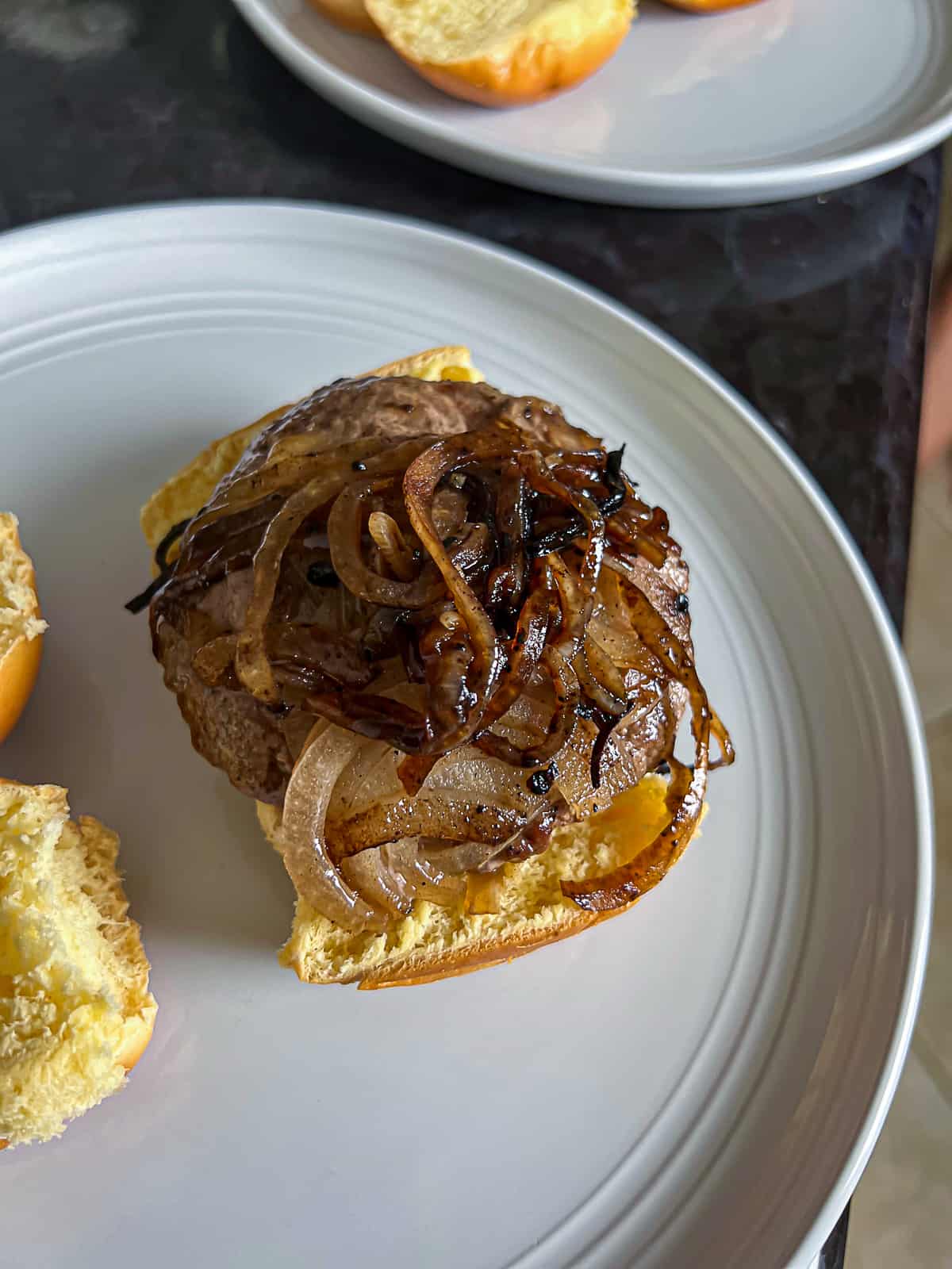 Closeup of Onion Smashed Burgers Medium Done Temperature In Hamburger Buns