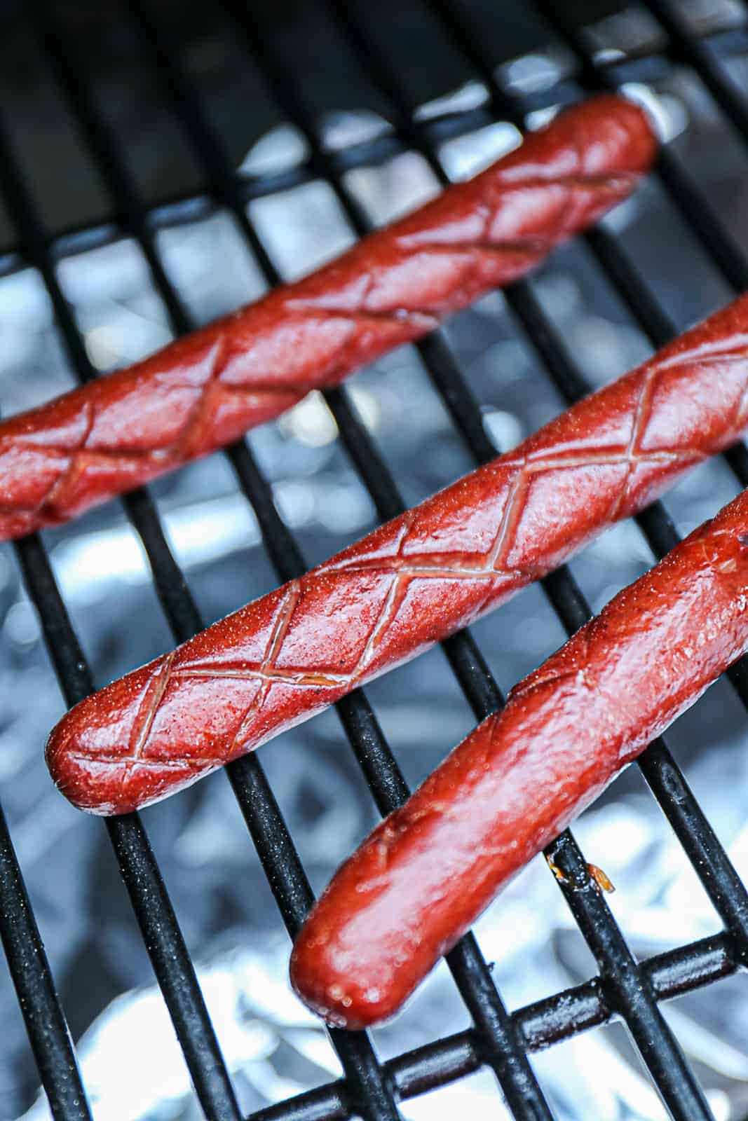 Closeup of Traeger Smoking Beef Hot Dogs 