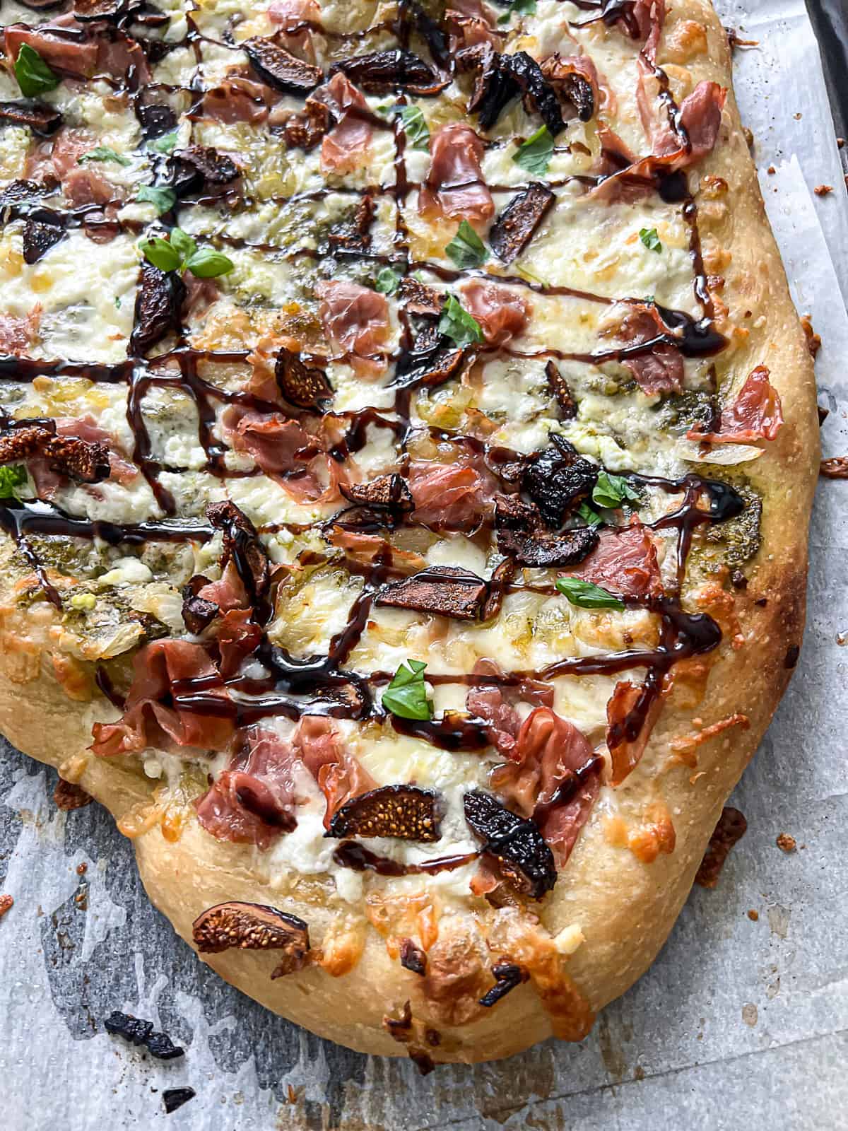 Closeup of gourmet pizza recipe for Fig And Prosciutto Flatbread Recipe