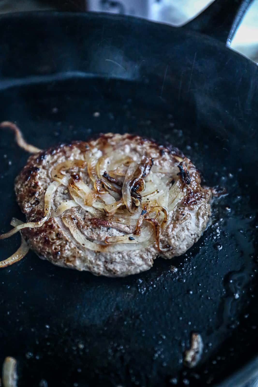 Example of Burger recipe for smashing burgers with onions in a griddle or cast iron pan