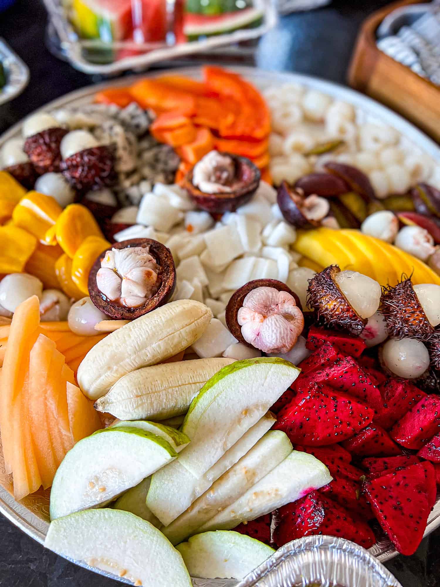 Exotic asian fruits on an appetizer platter board
