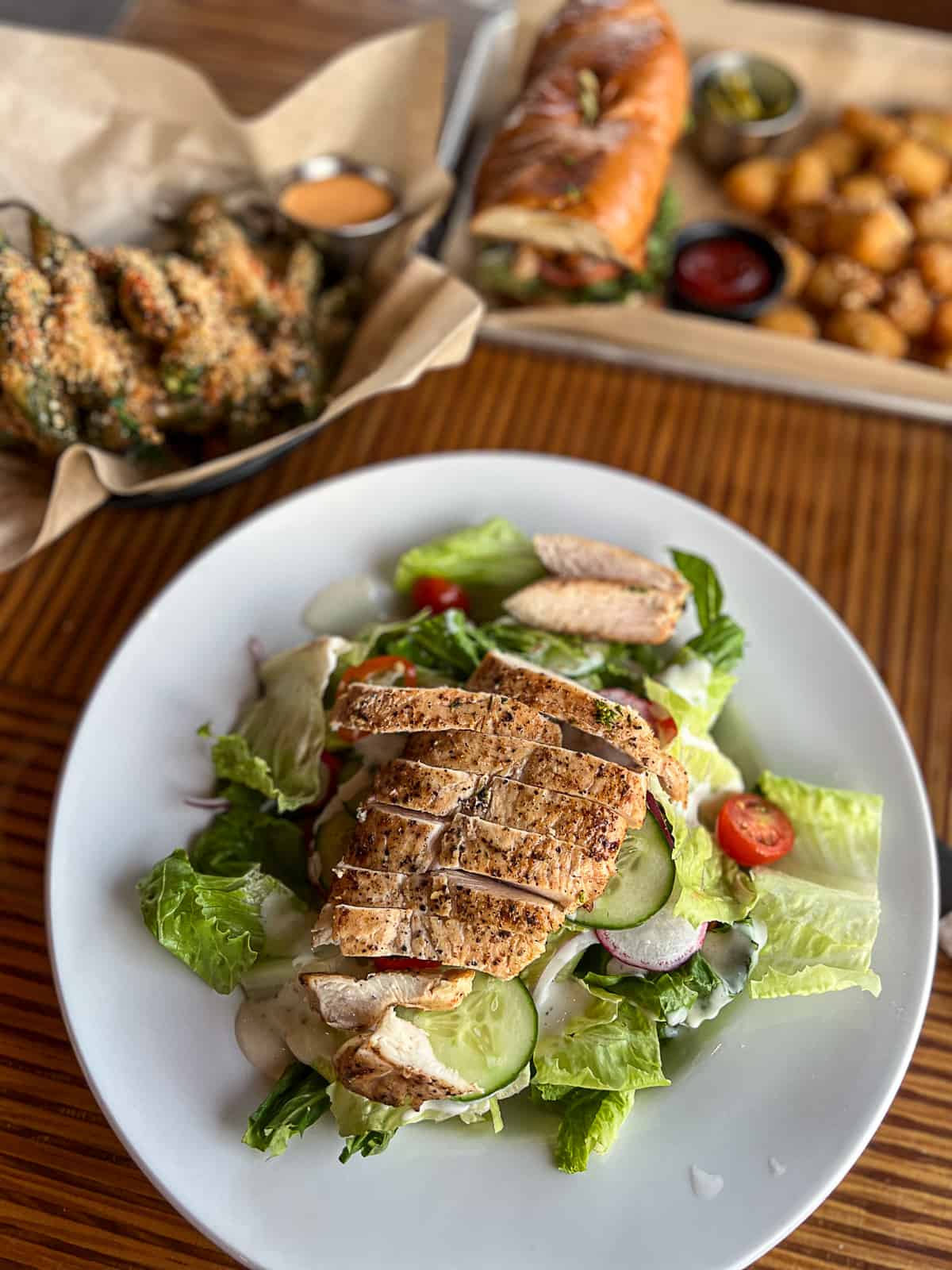 Chicken salad and shrimp po boy from the menu at Revelry on the Boulevard Austin TX 14