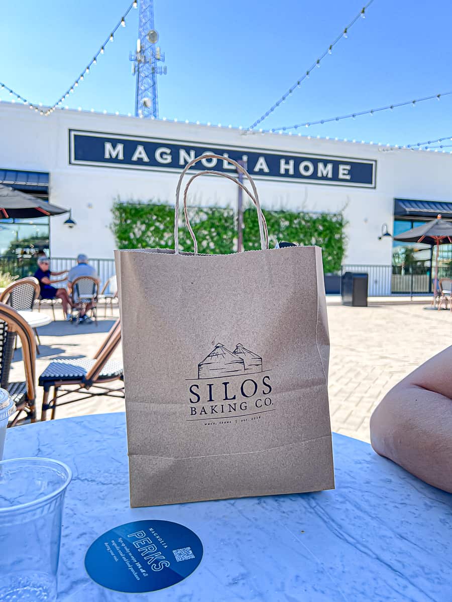 Magnolia Home Store in Waco Texas with a bag from Silos Bakery