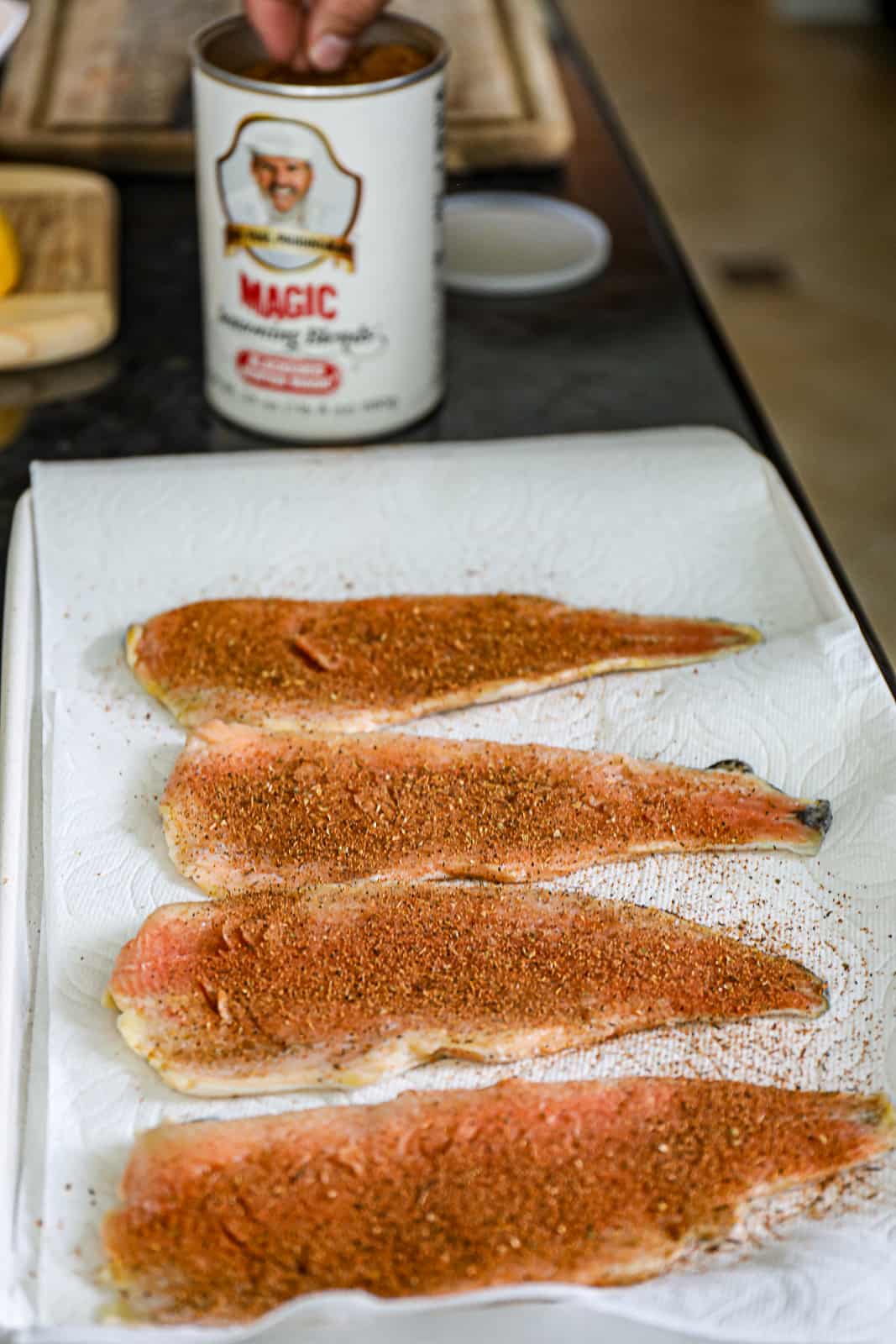 Seasoning trout for smoking on the Traeger pellet grill Sip Bite Go
