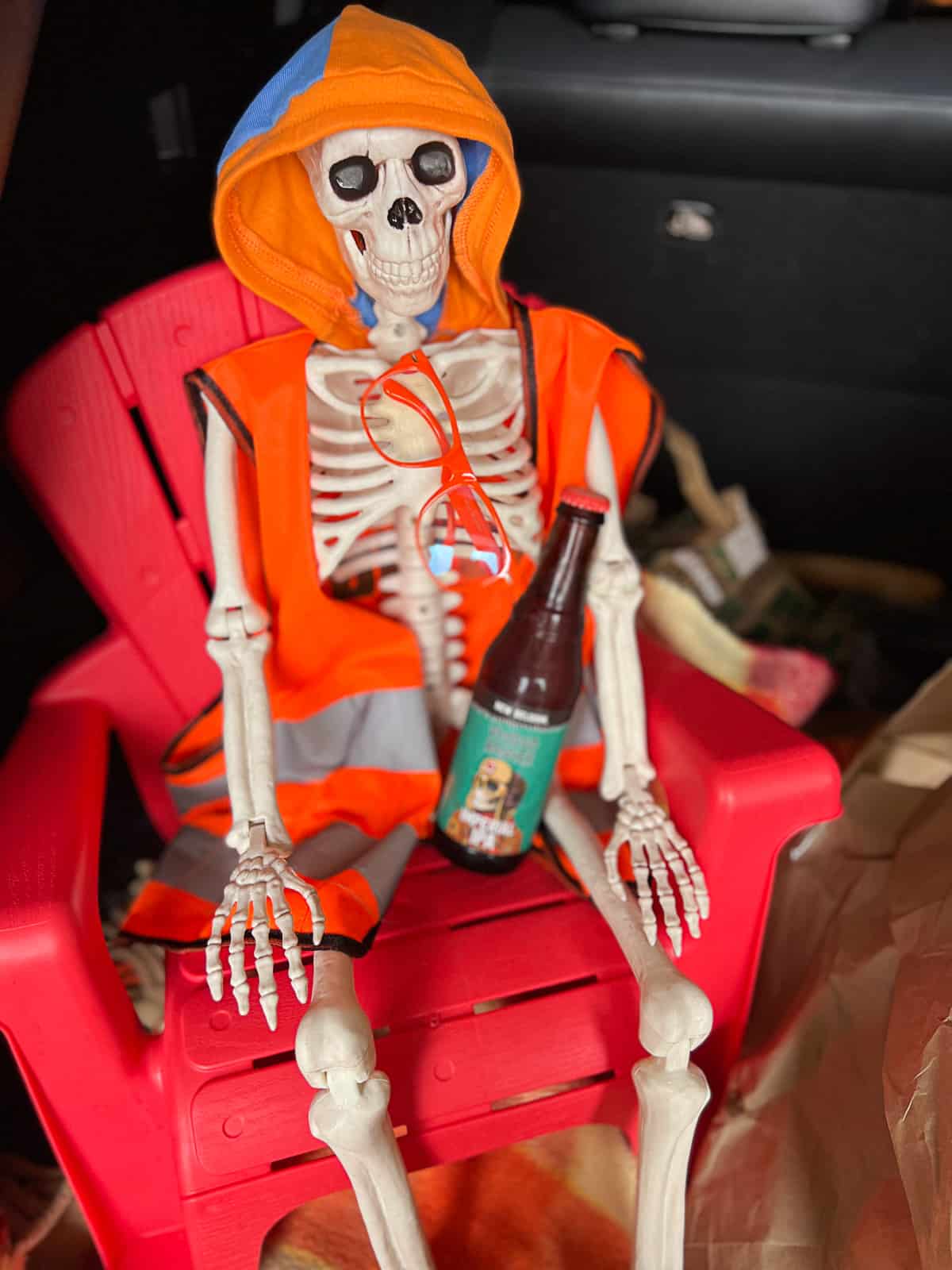 campsite halloween trunk or treat decor with a skeleton dressed as Blippi