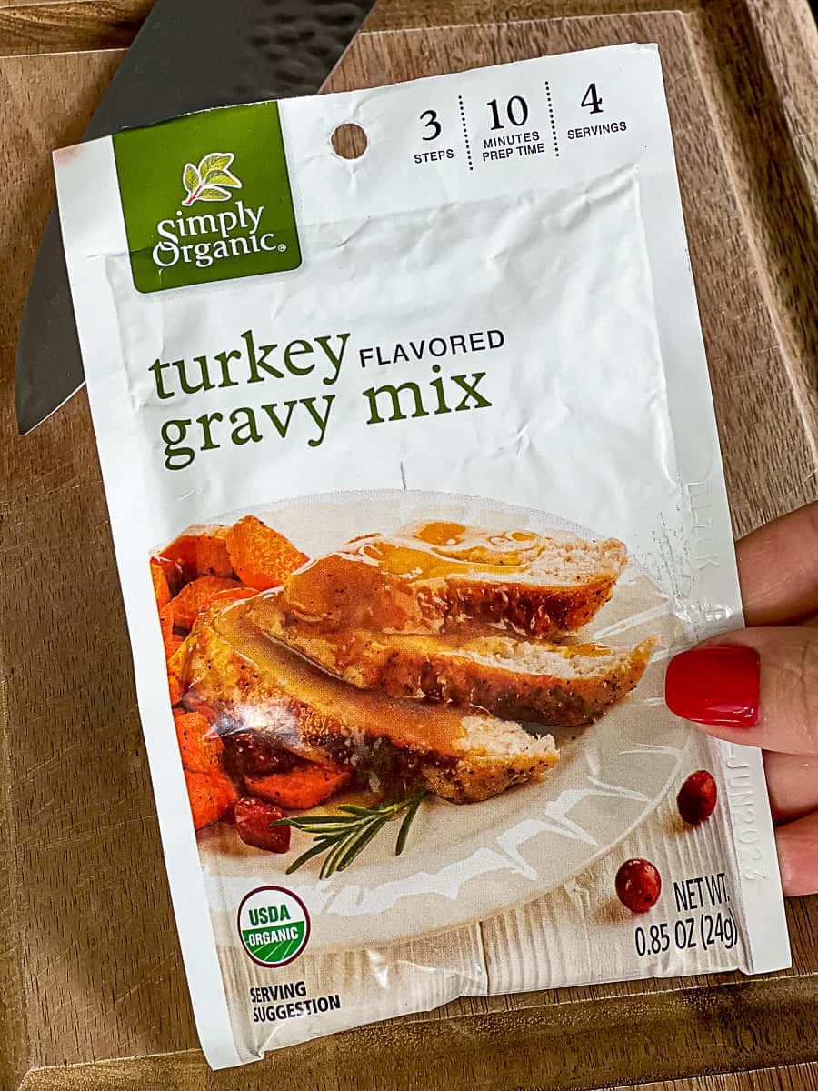Holding a Simply Organic Turkey Gravy Packet