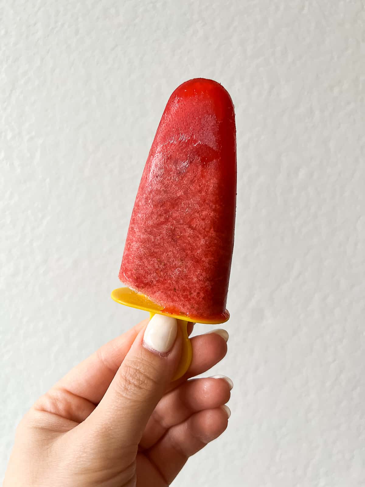 Holding a homemade popsicle on Ikea popsicle mold stick 